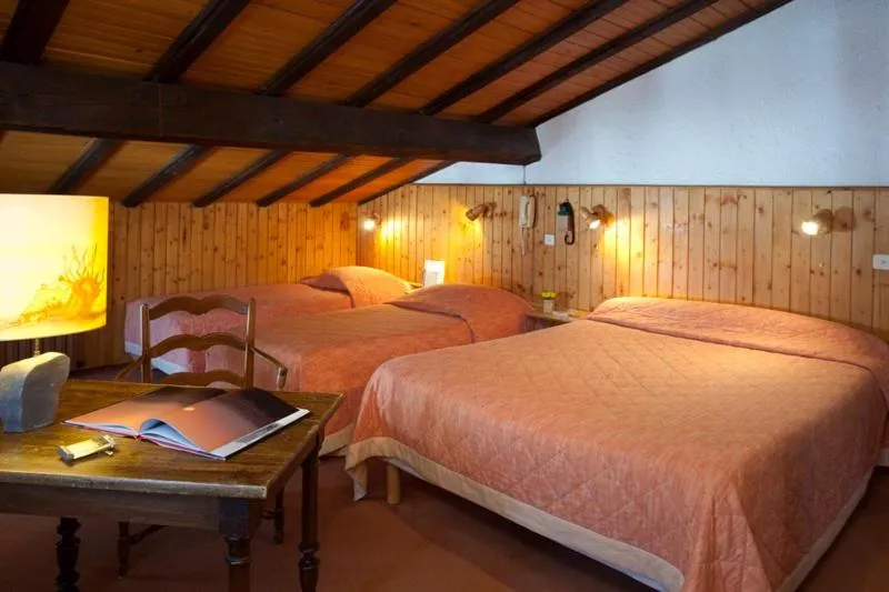 Photo of the whole room, Bed in Logis Hôtel La Petite Chaumière