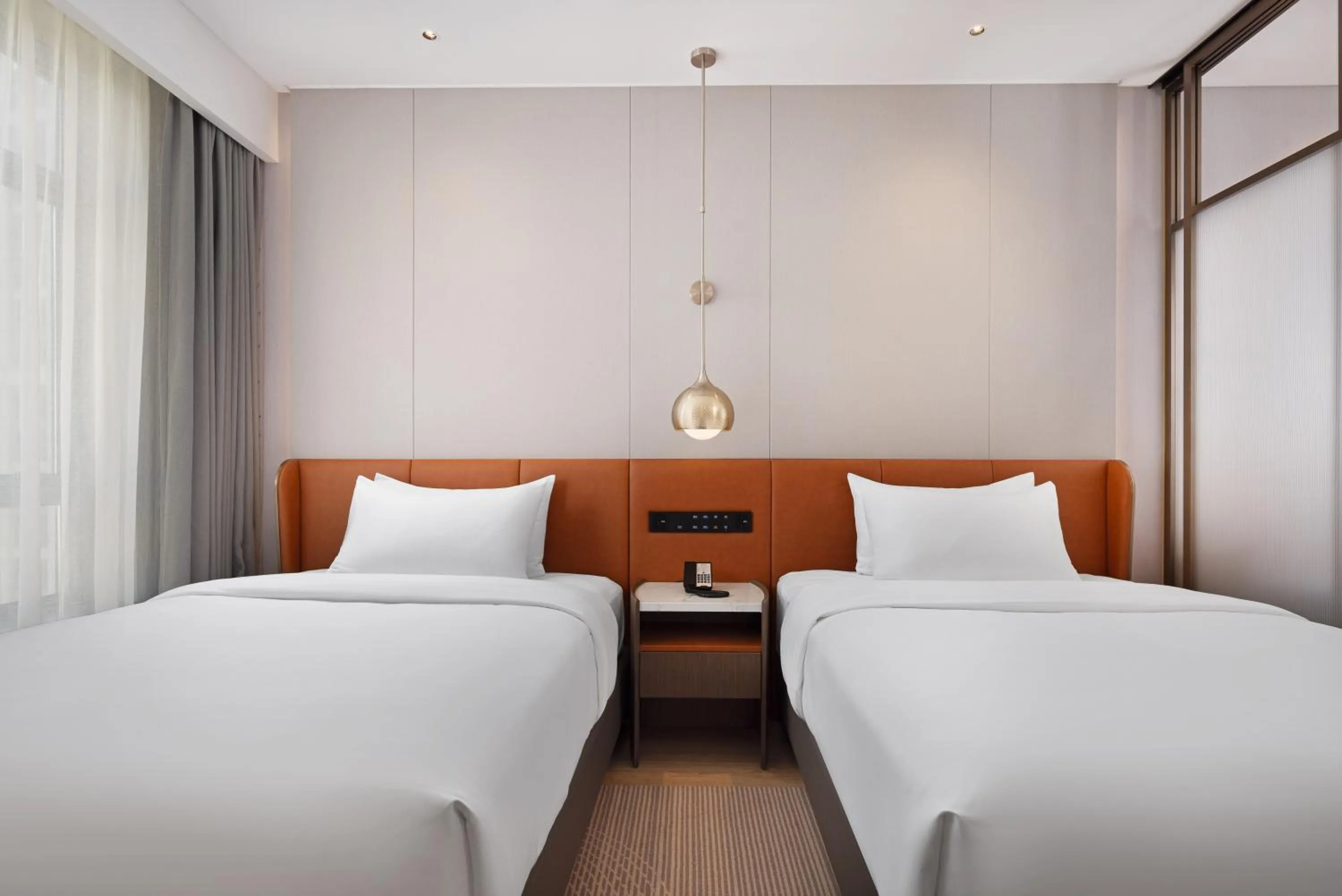 Bed in Home2 Suite by Hilton Jingzhou Wanda Plaza