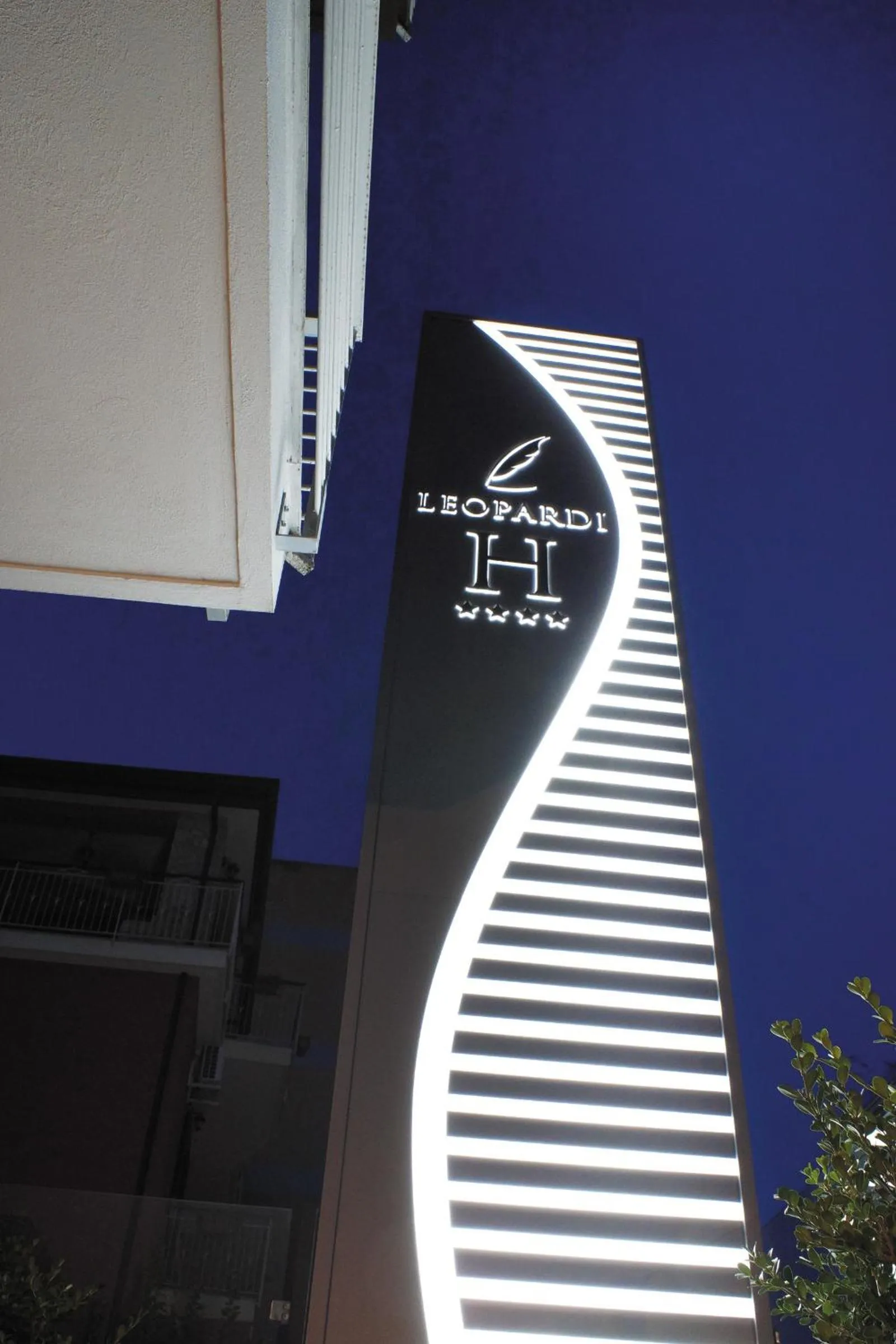 Property logo or sign in Hotel Leopardi