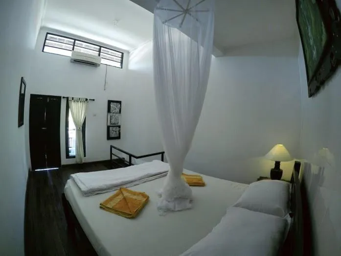 Bed in Tirta Yoga Inn
