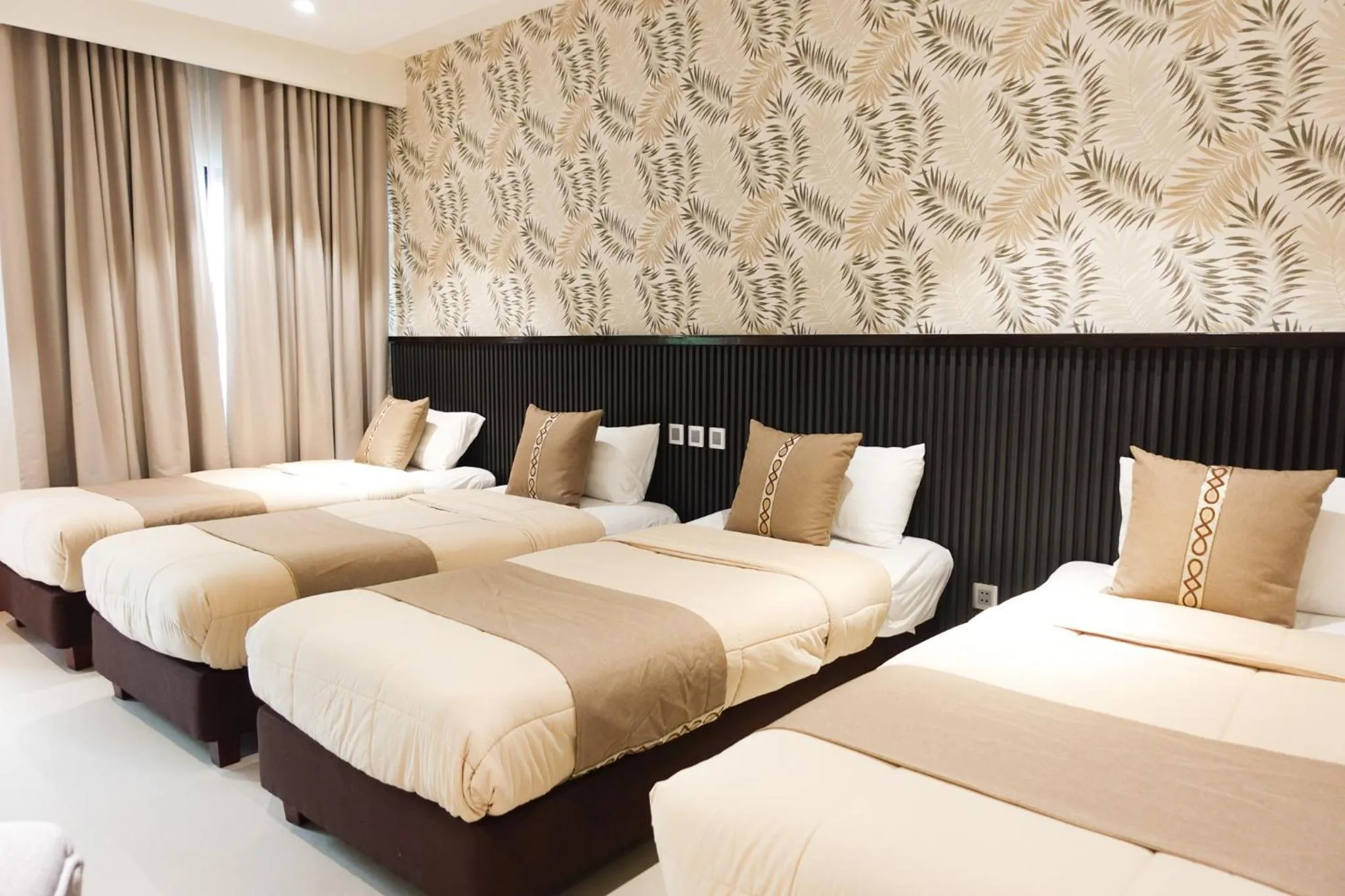 Deluxe Quadruple Room in The Tropics at MacArthur Park Resort and Convention Center