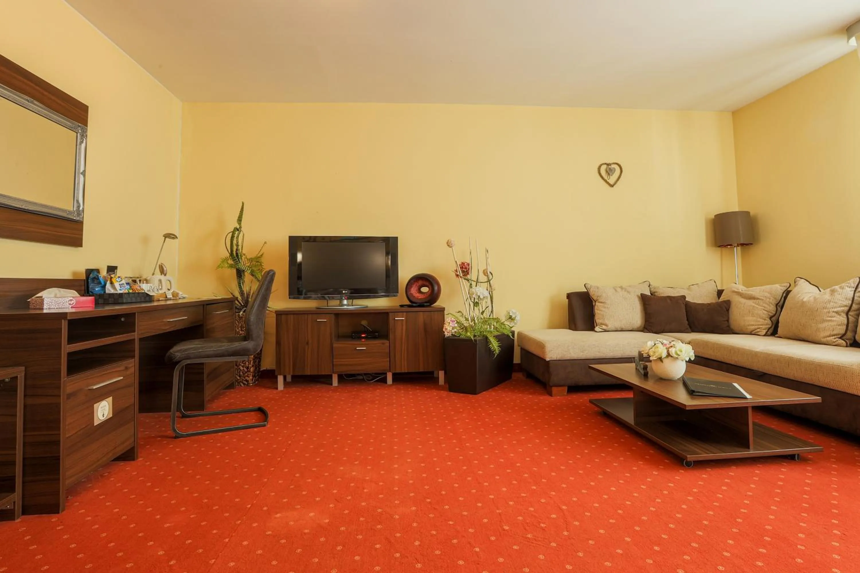 Communal lounge/ TV room in Grand Hotel Senica, Garni