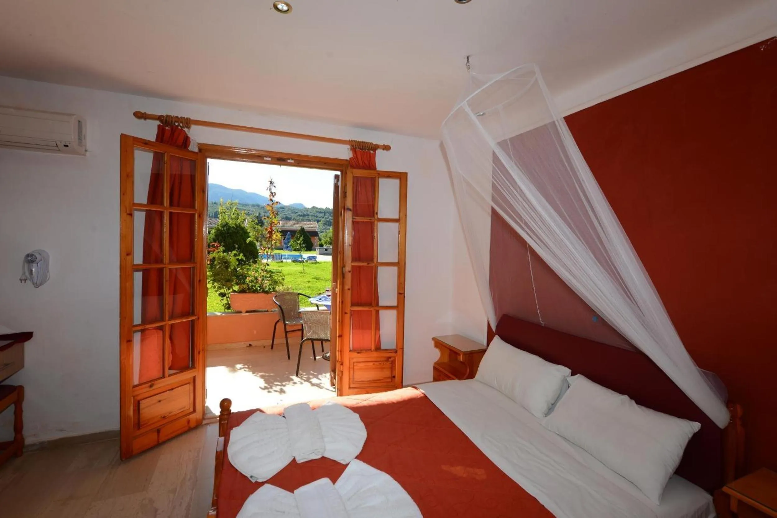 Property building, Bed in Charlies Venus Apartments