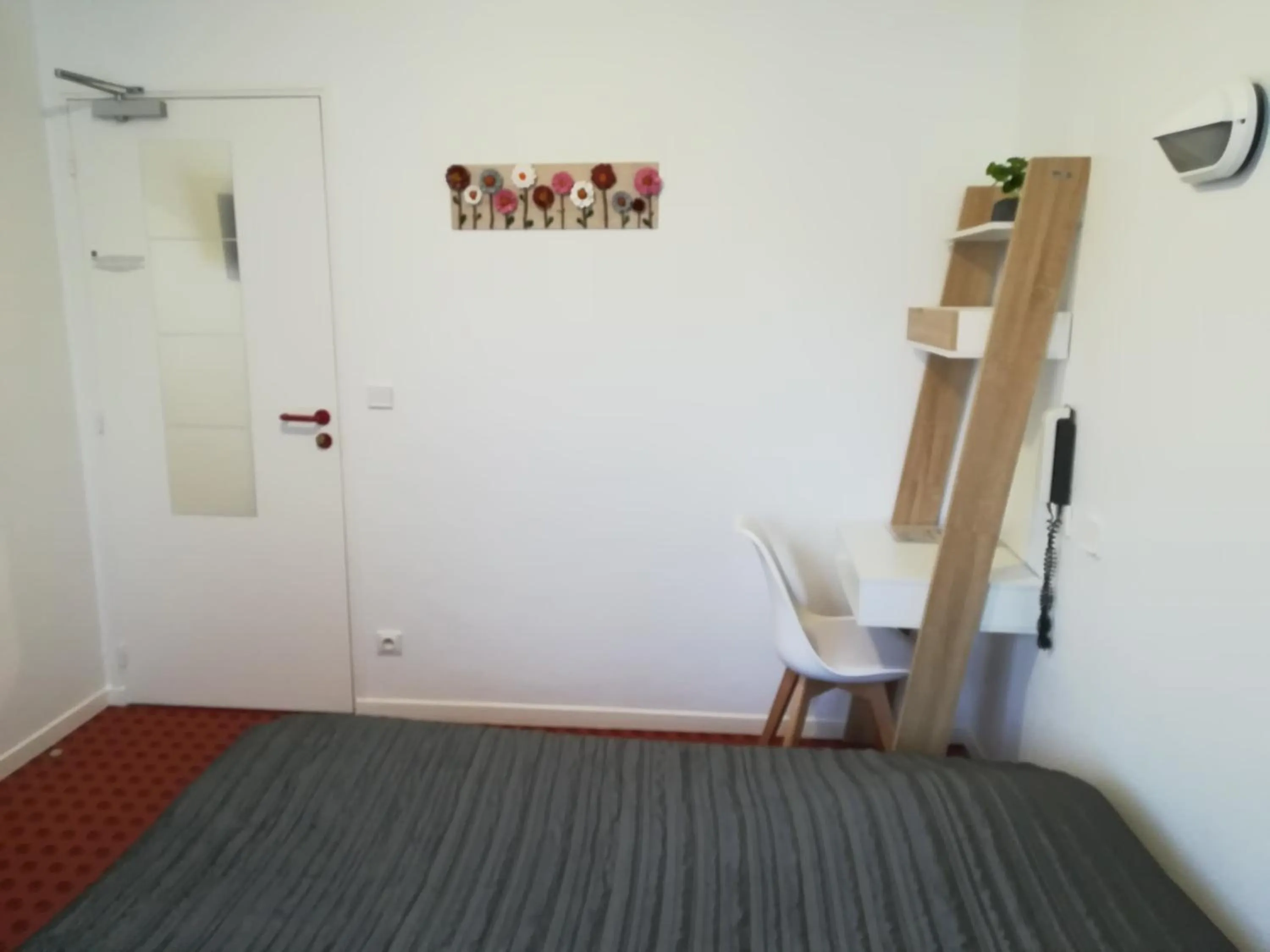 Communal lounge/ TV room in Hotel De La Poste