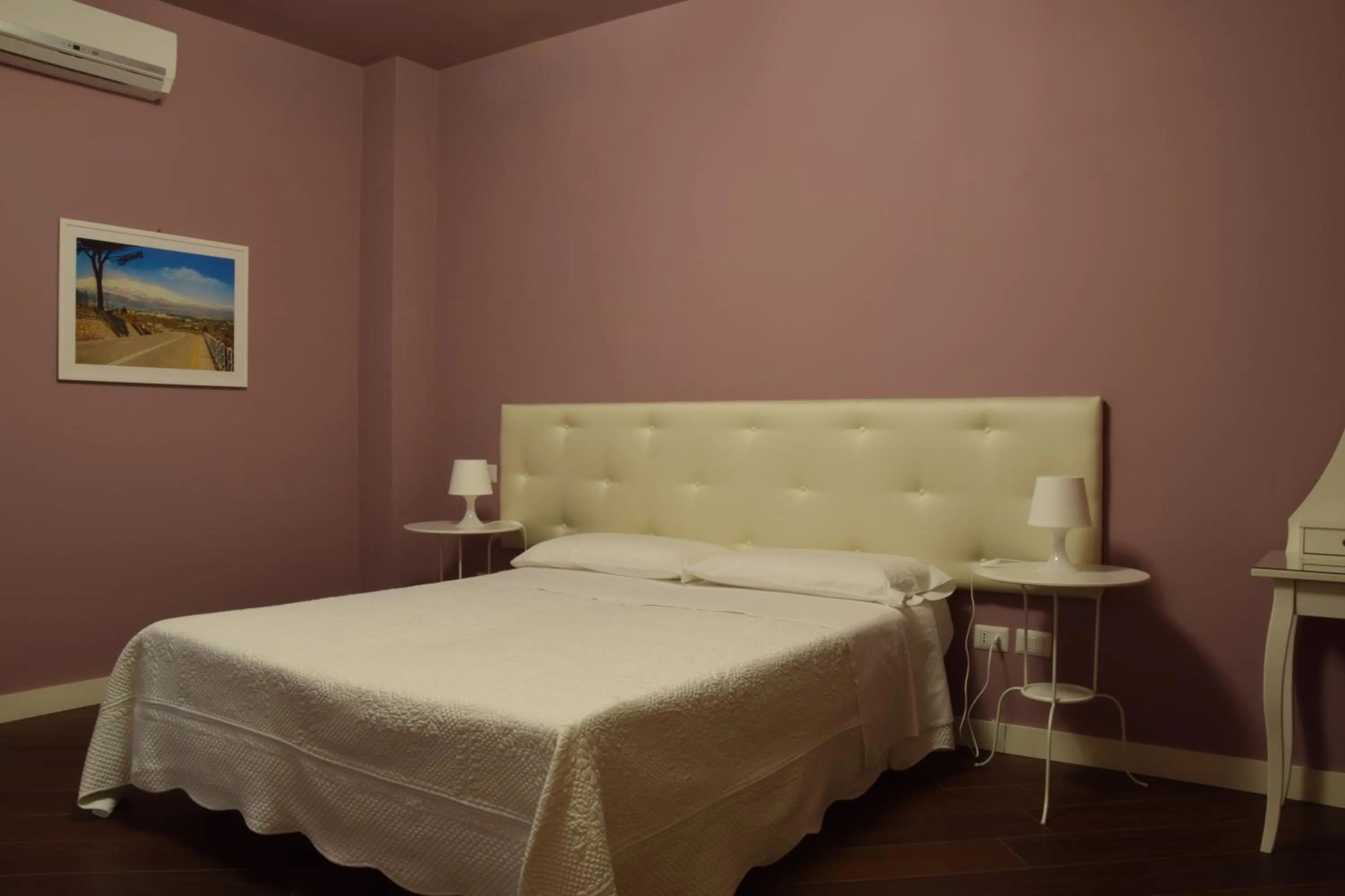 Photo of the whole room, Bed in Residenza Cavour