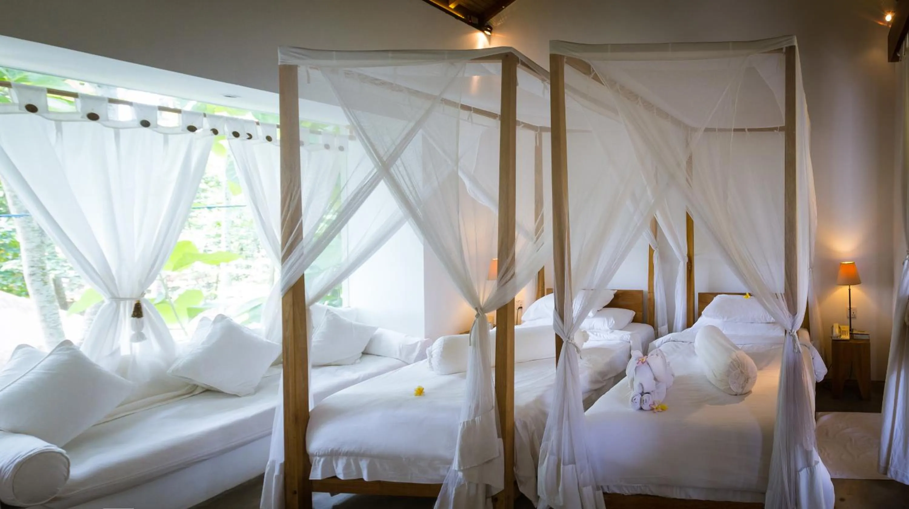 Bed in De Ubud Villas & Spa