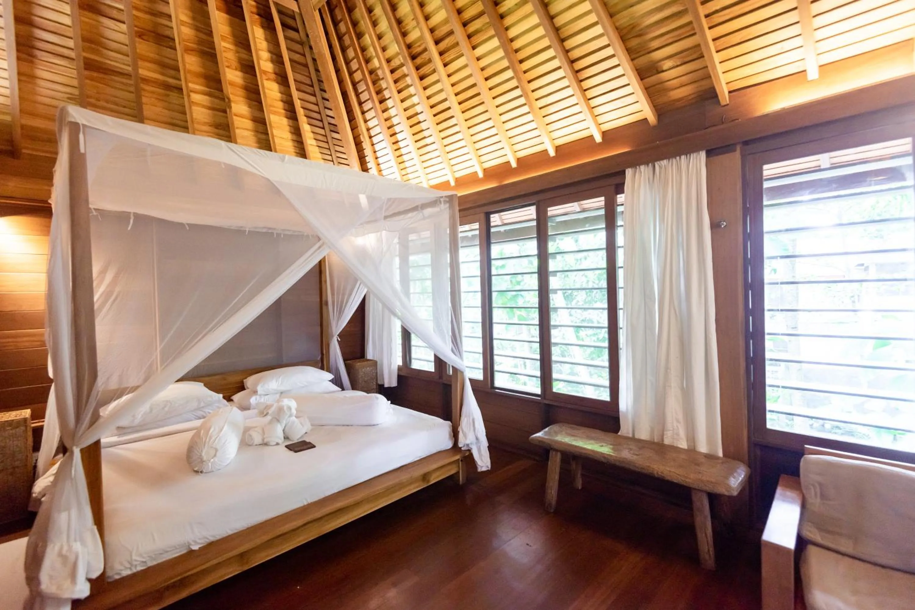 Bed in De Ubud Villas & Spa