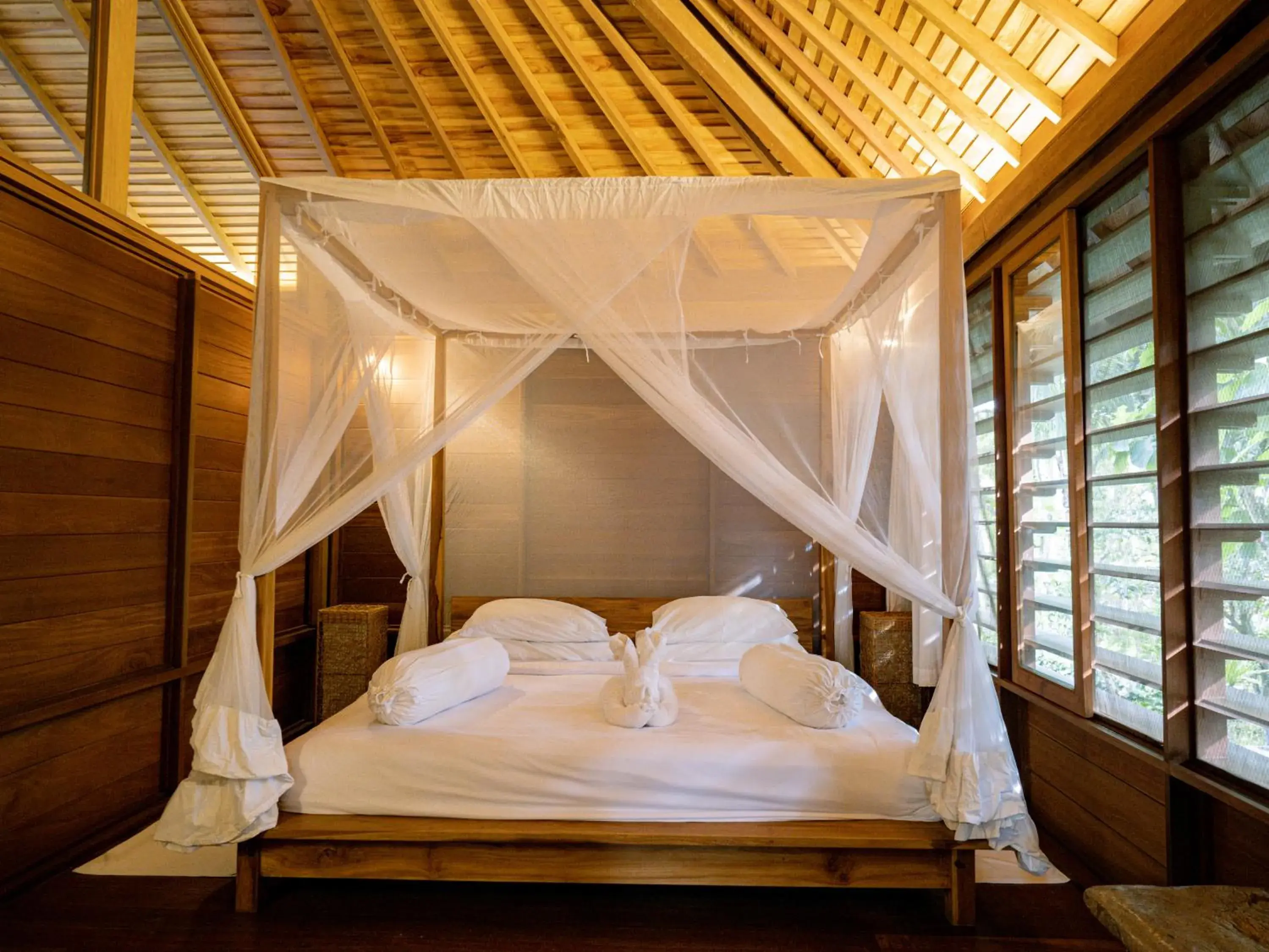 Bed in De Ubud Villas & Spa Bed in De Ubud Villas & Spa