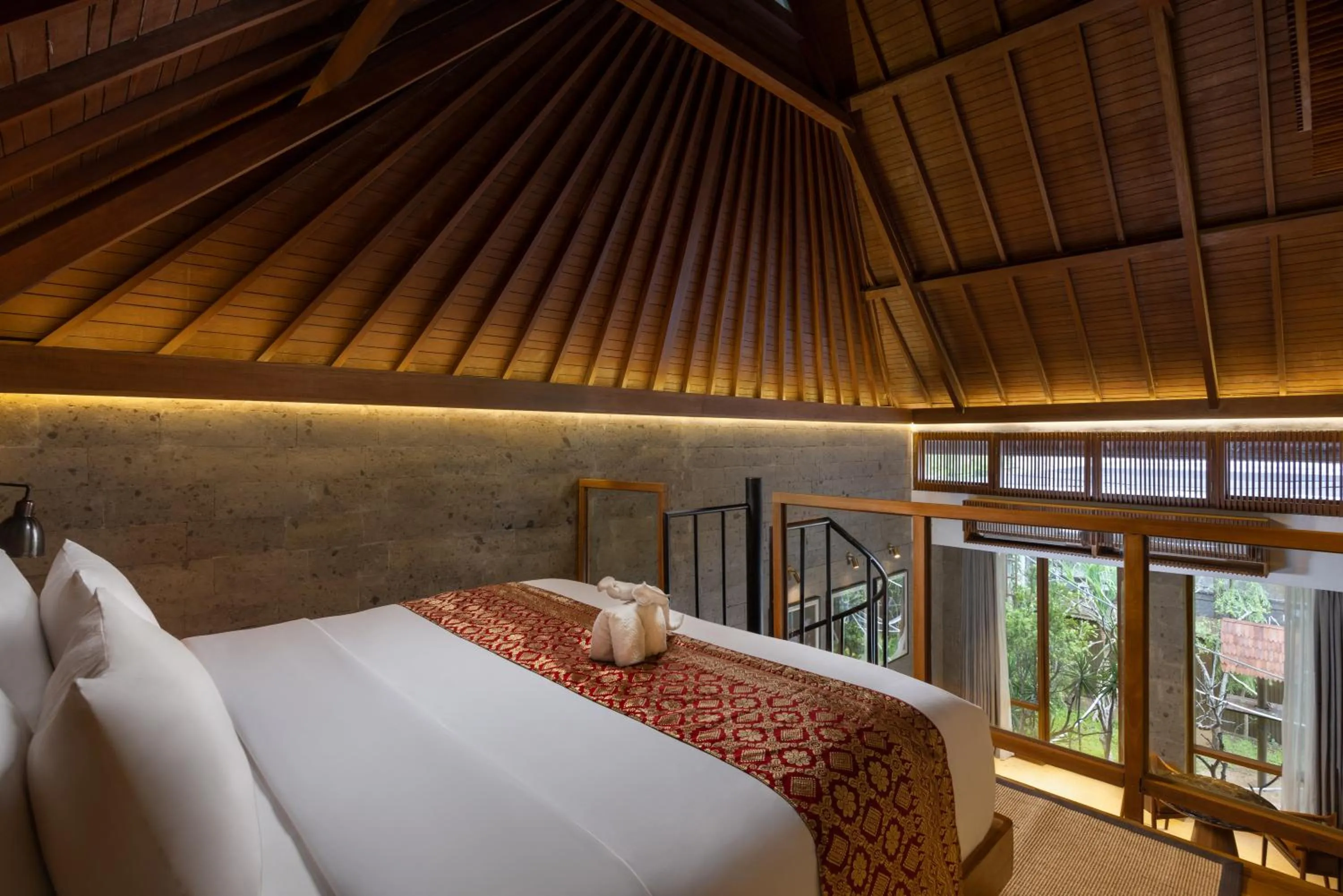 Bed in Sanctoo Suites & Villas