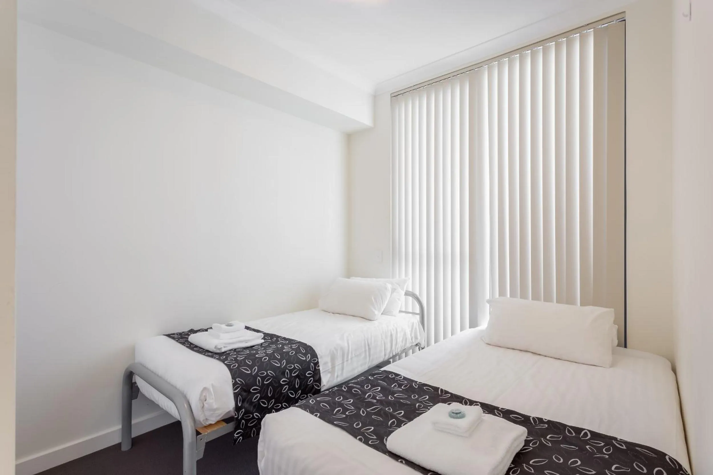 Day, Bed in Nautilus by Rockingham Apartments