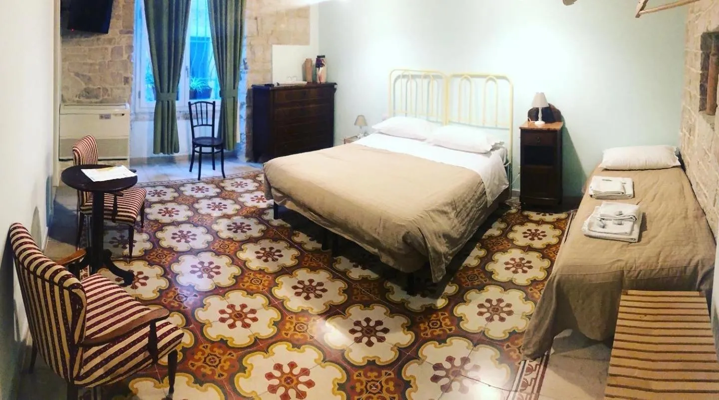 Bed in Palazzo Lupicini Affittacamere