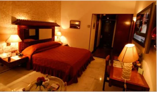 Photo of the whole room, Bed in Ashok Country Resort