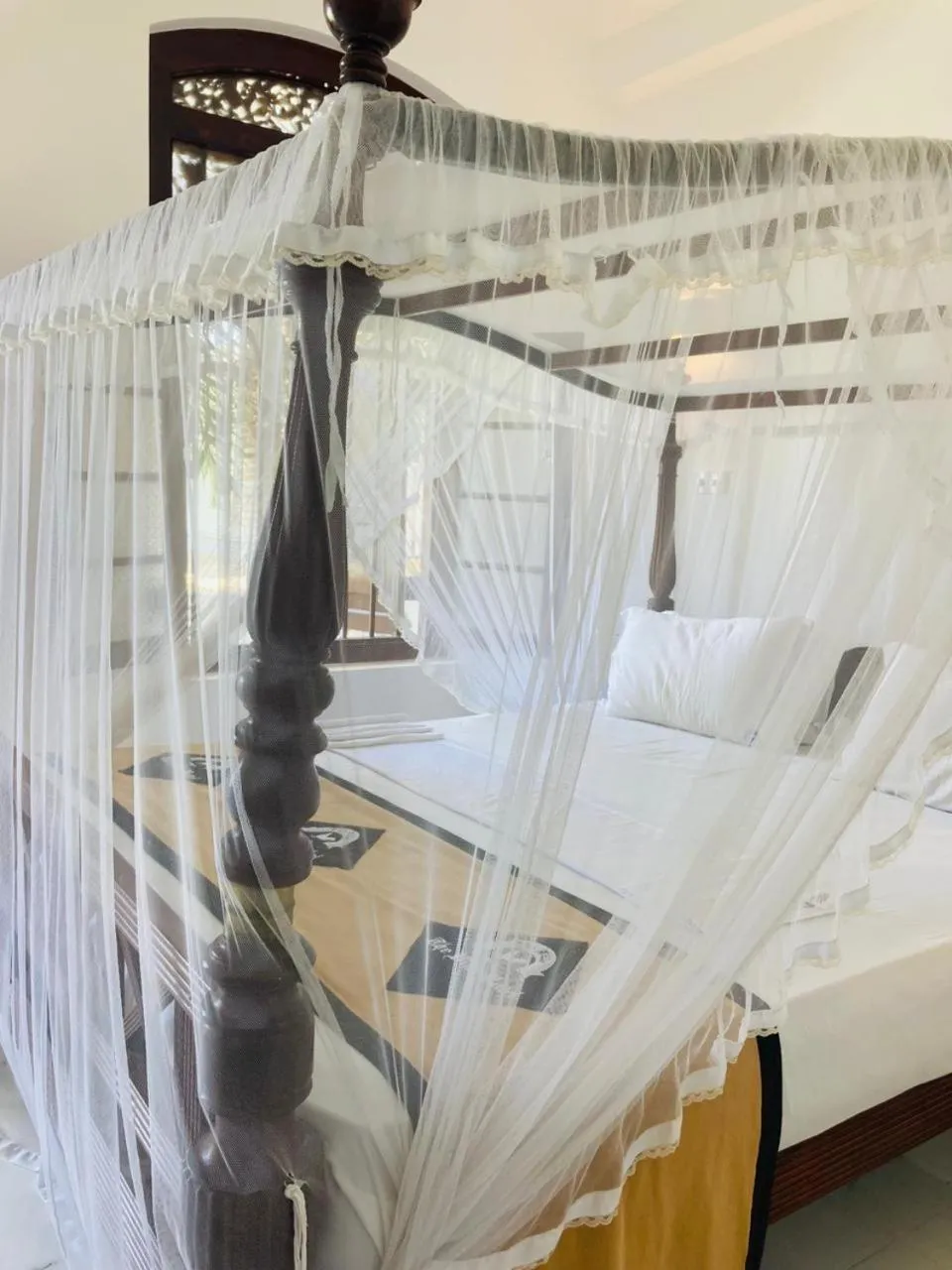 Bed in The Villa Hotel