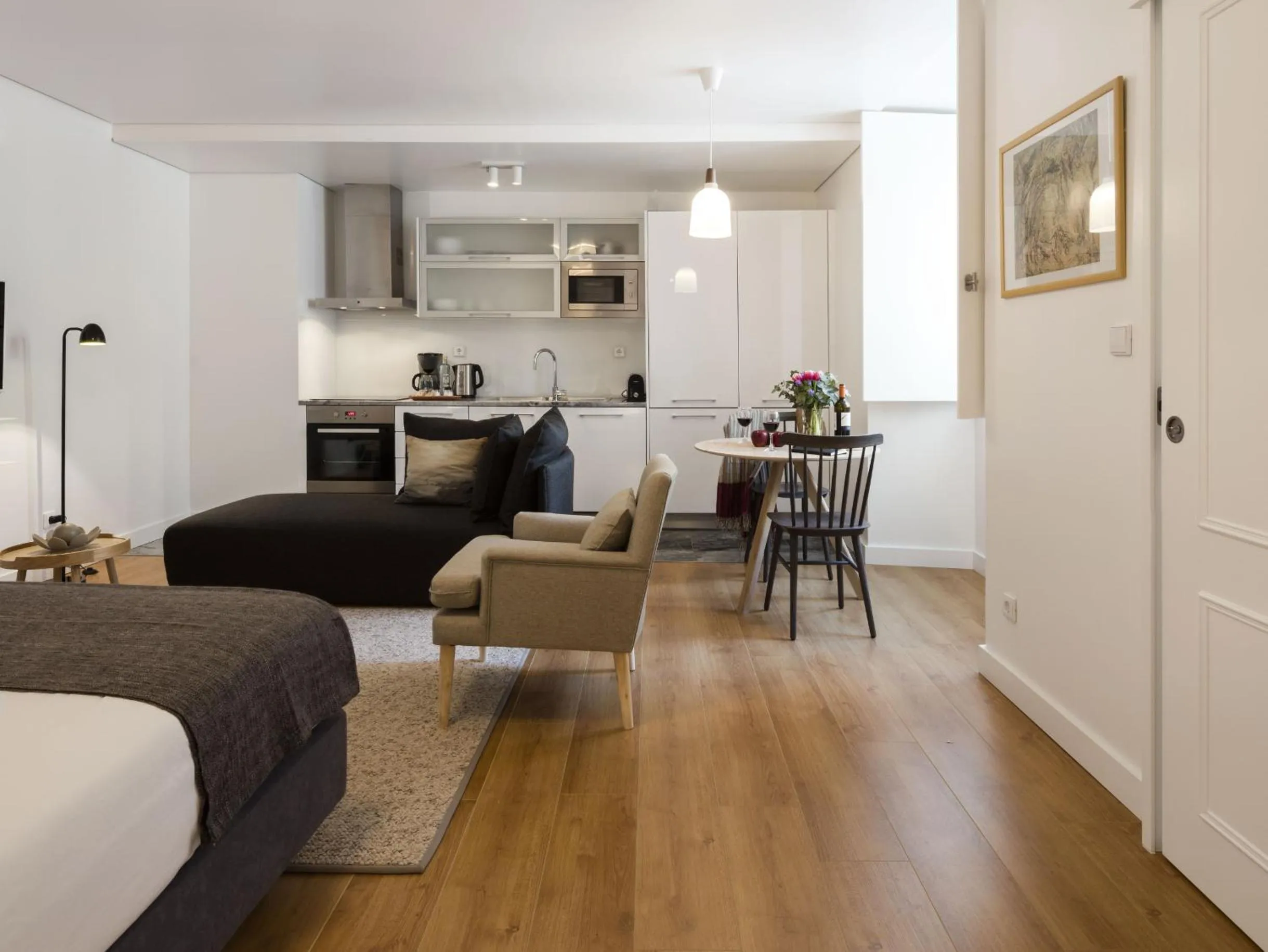 Seating area in LSA Baixa Castelo by Numa