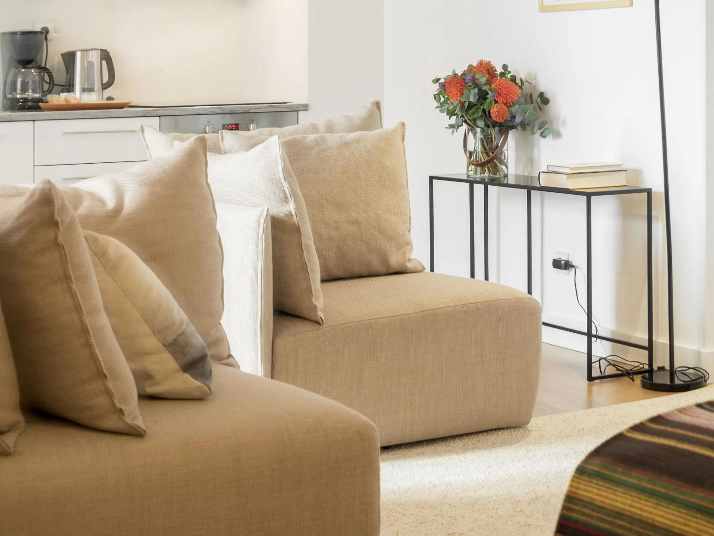 Seating area in LSA Baixa Castelo by Numa