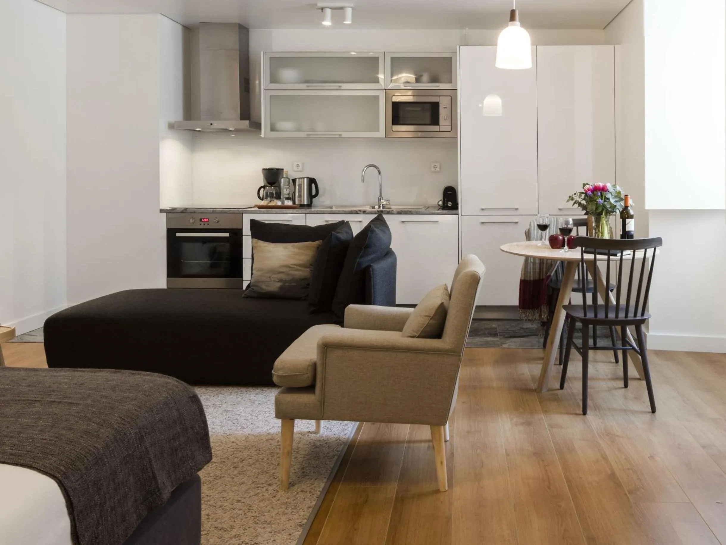 Seating area in LSA Baixa Castelo by Numa