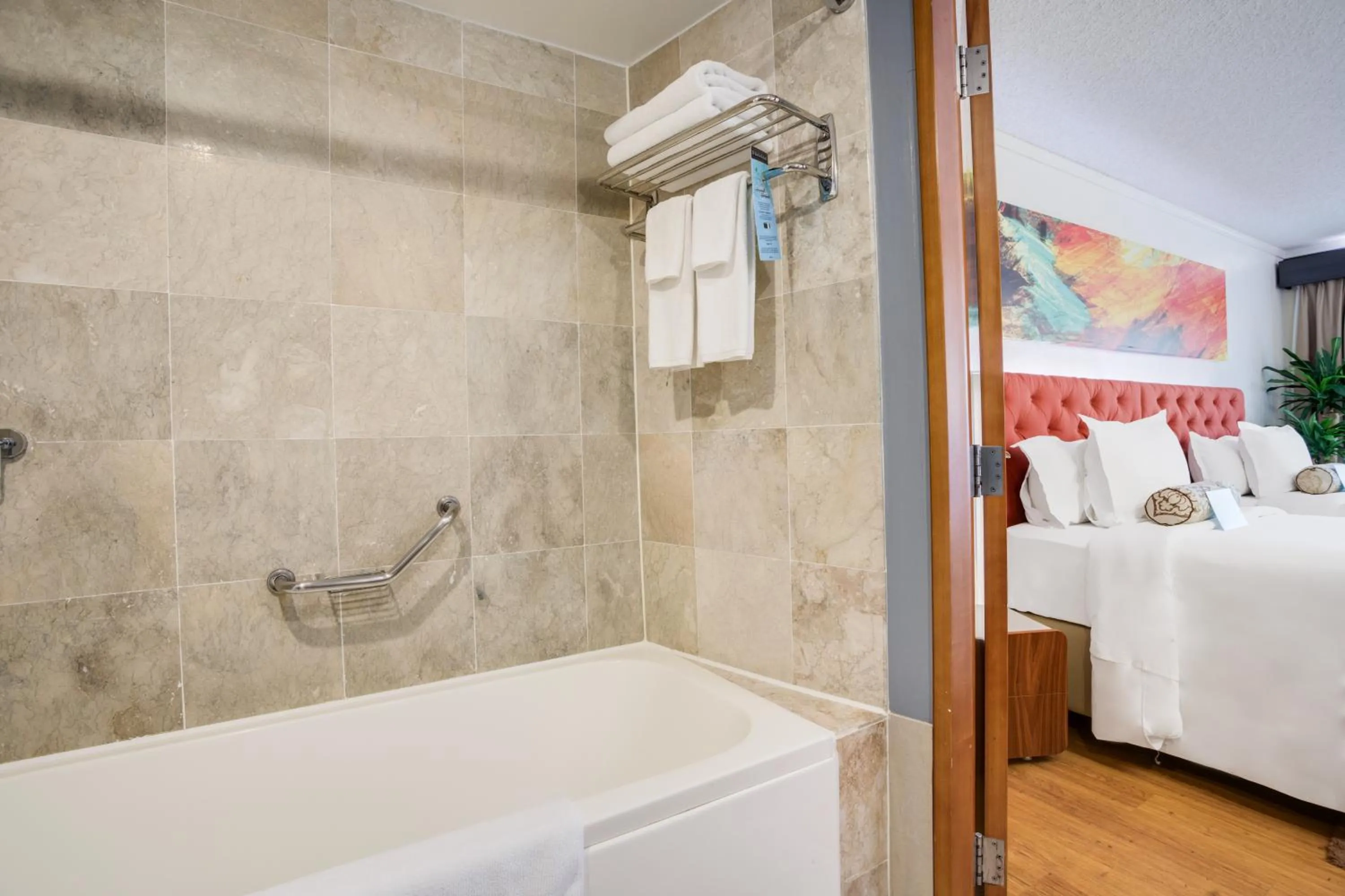 Bathroom, Bed in Guam Plaza Resort
