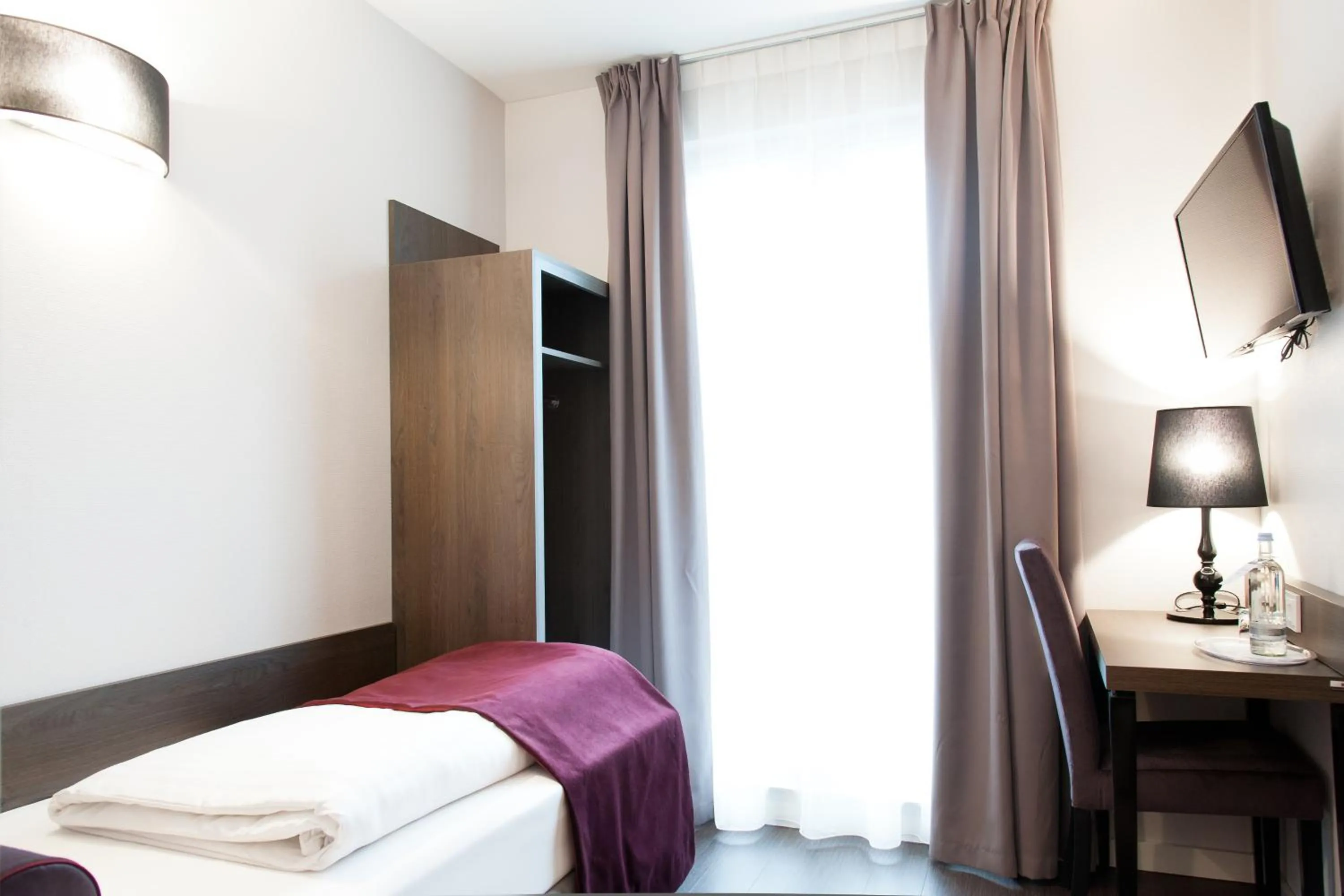 Photo of the whole room, Bed in Fair Hotel Europaallee