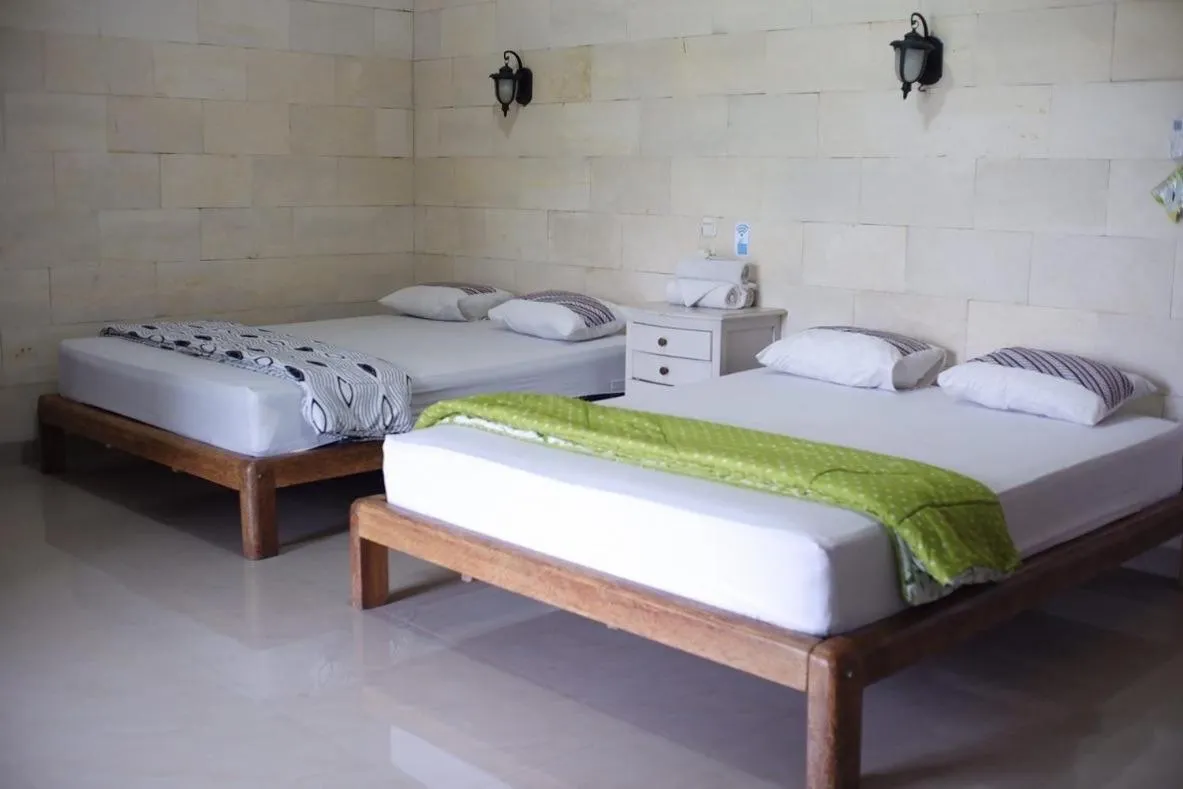 Bed in Lotus 2 Guest House