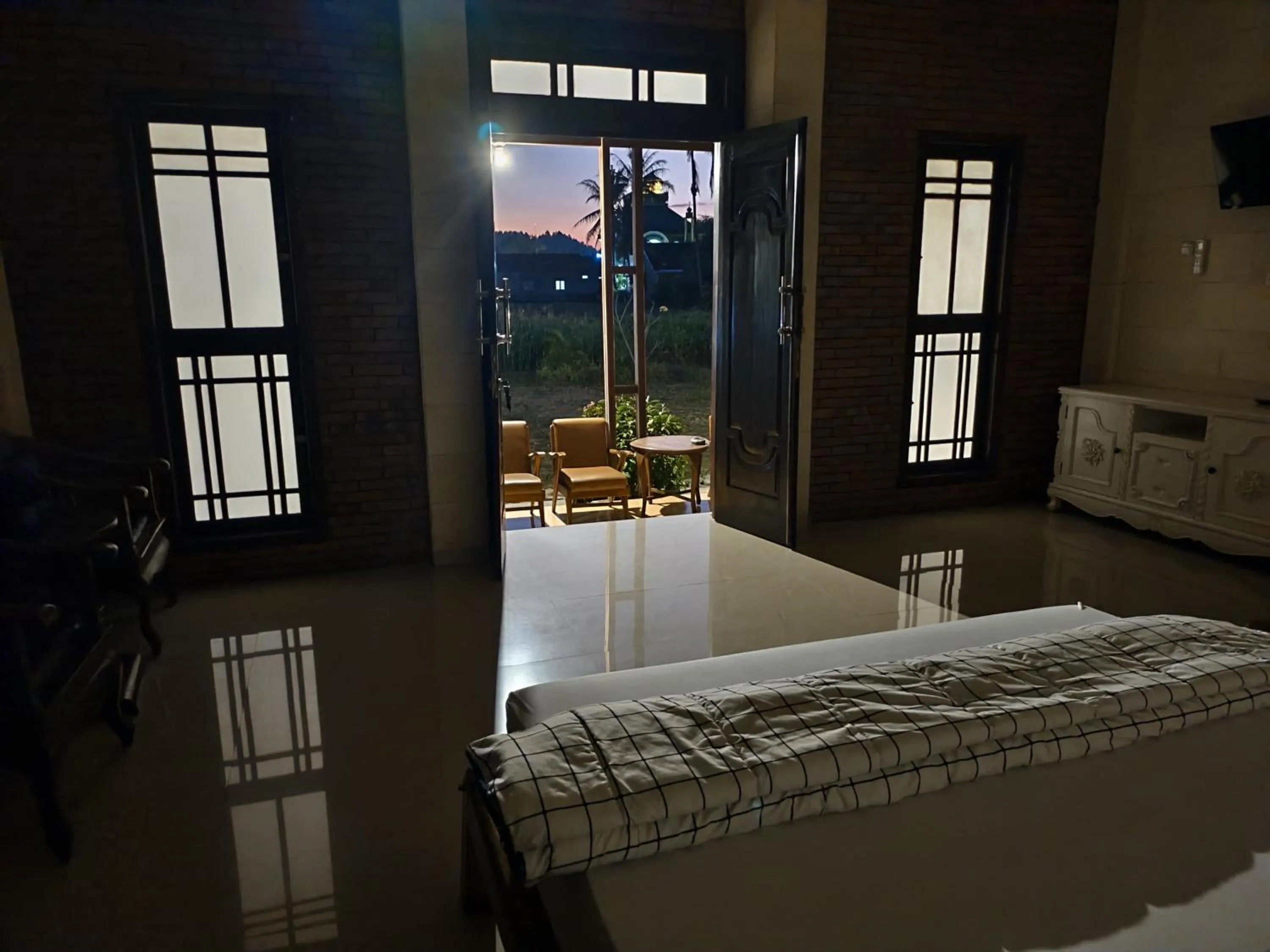 Bed in Lotus 2 Guest House