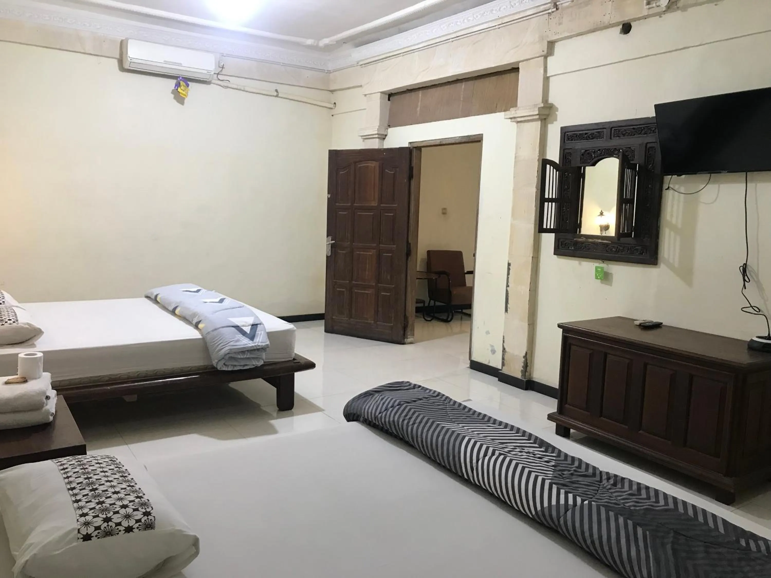 Bed in Lotus 2 Guest House