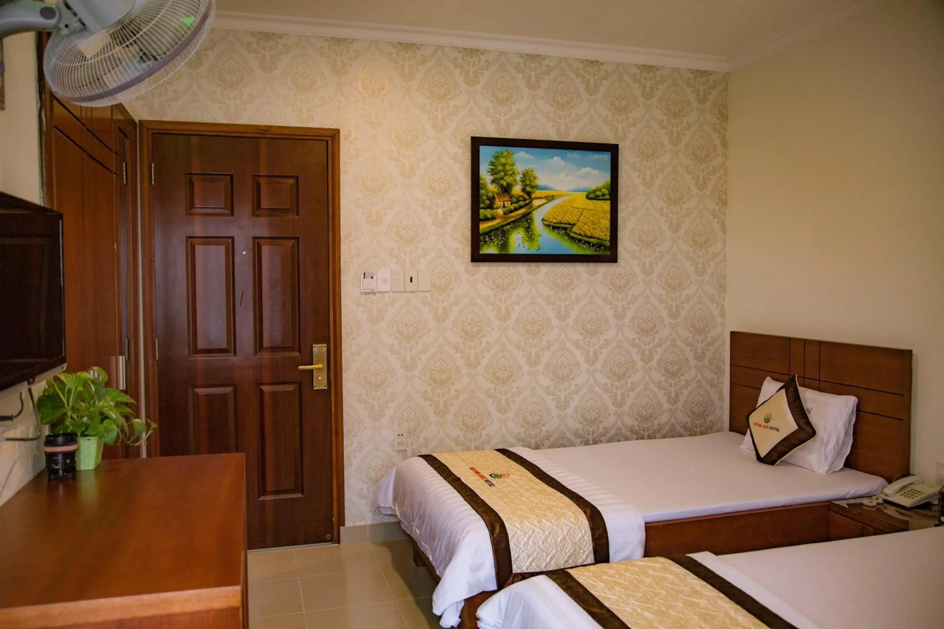 Bed in Huynh Duc Hotel Bed in Huynh Duc Hotel