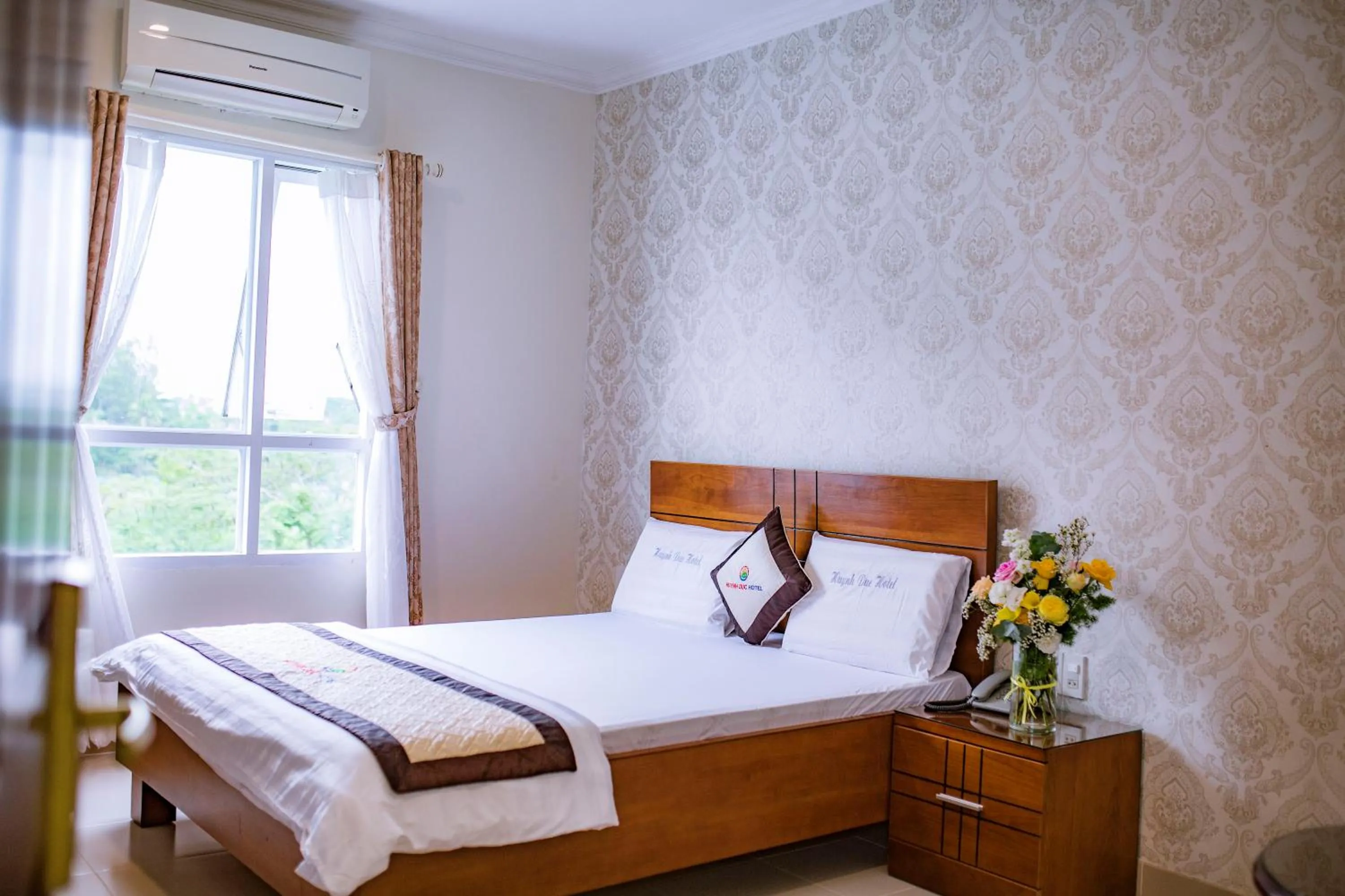 Bed in Huynh Duc Hotel