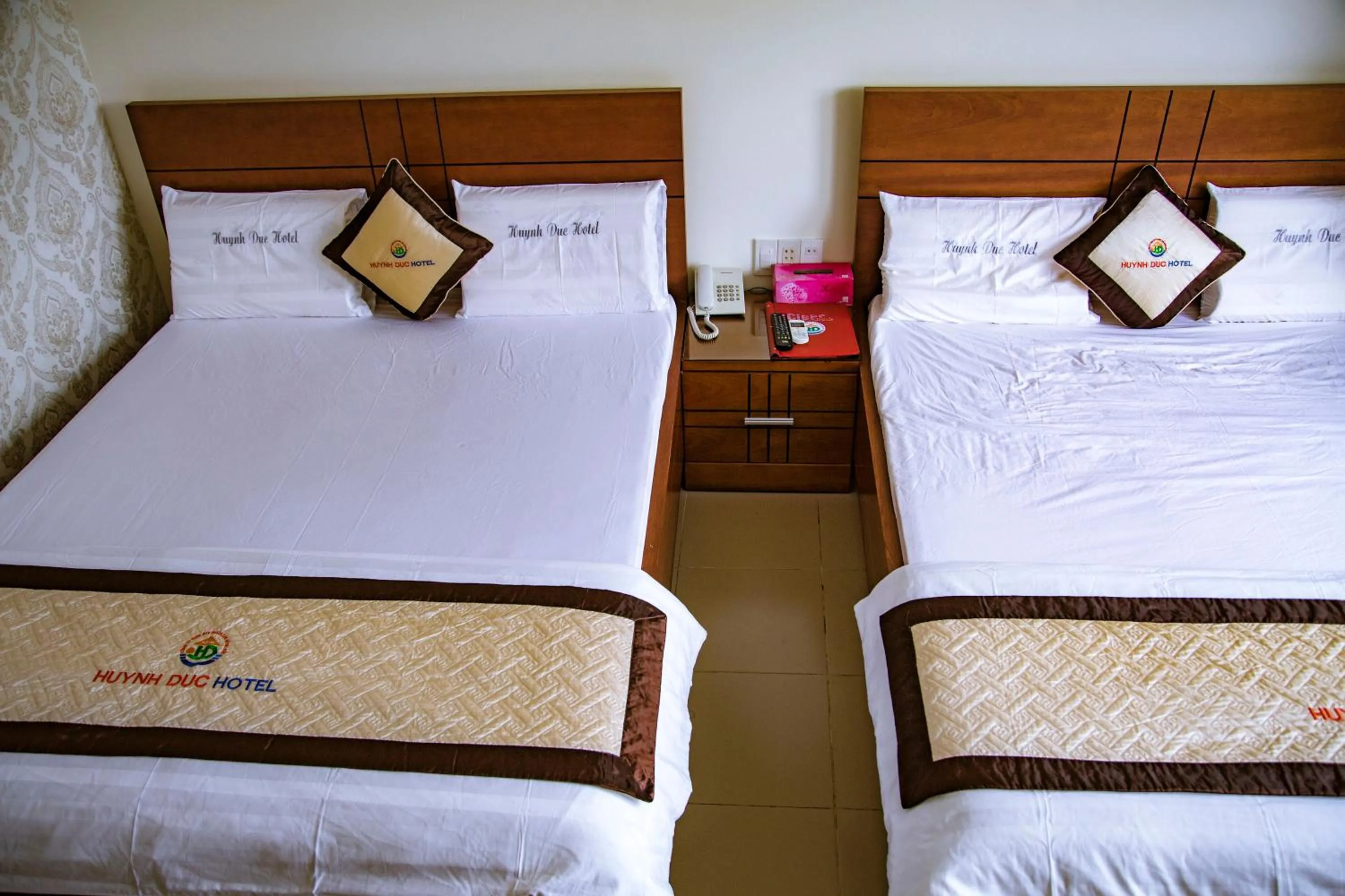 Bed in Huynh Duc Hotel