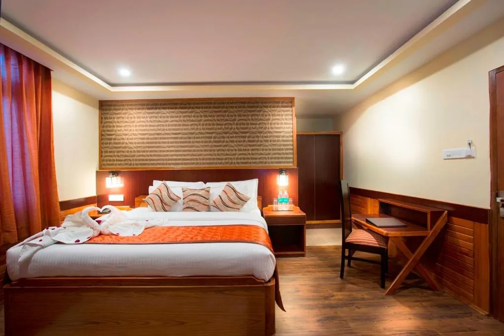 Photo of the whole room, Bed in New Orchid Lords Inn Gangtok