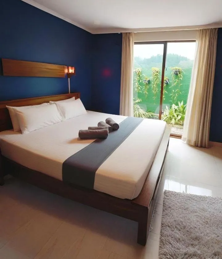 Bed in Windy's Leisure Villa