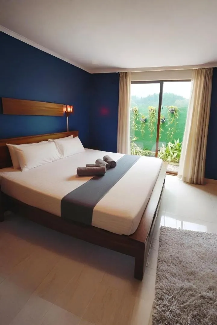 Bed in Windy's Leisure Villa
