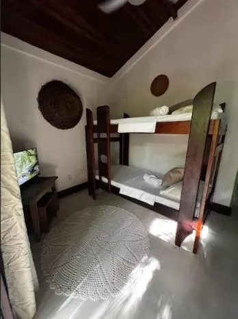 Bed in Pousada Bromélias
