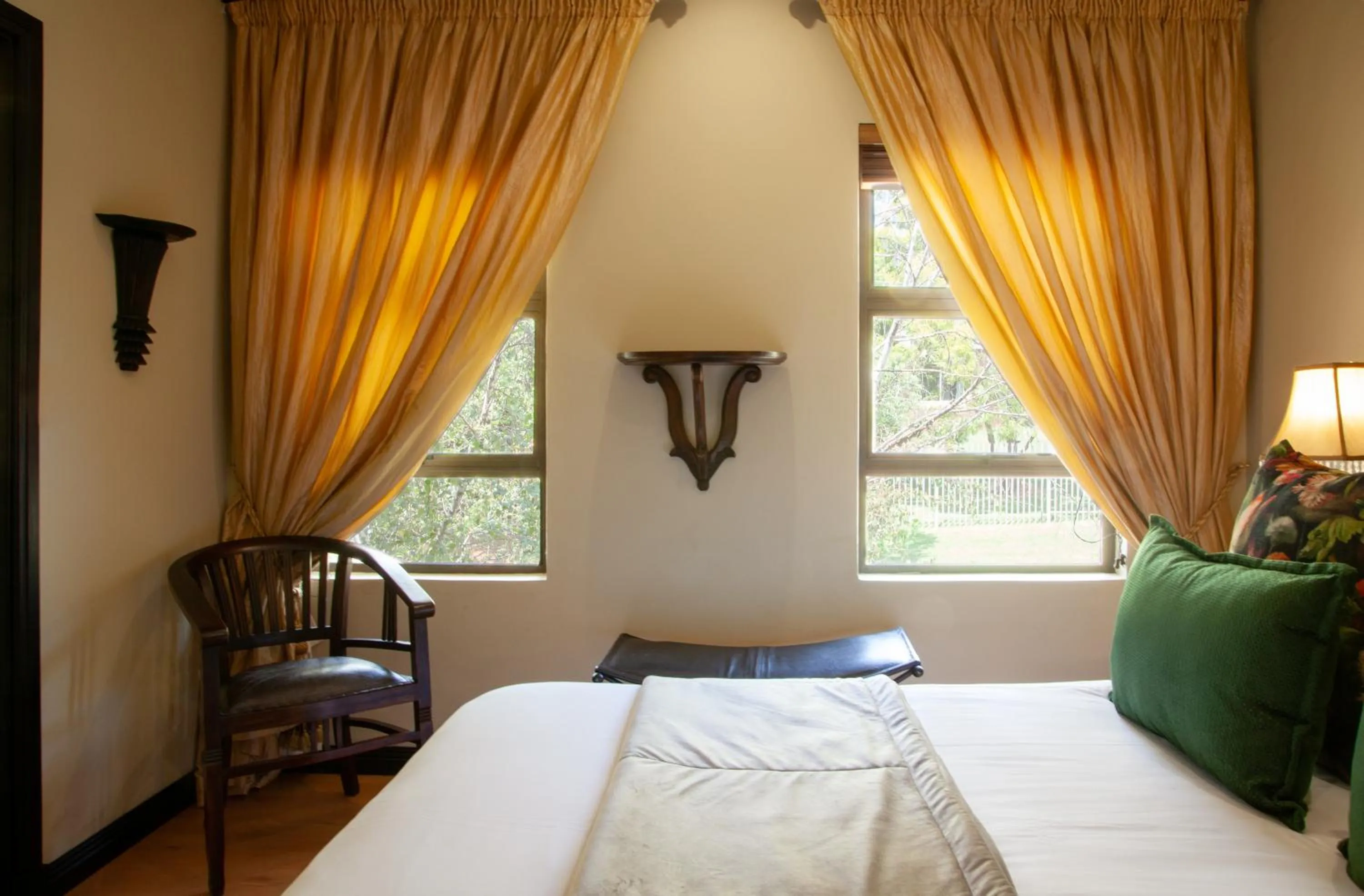 Bed in InnJoy Boutique Hotel