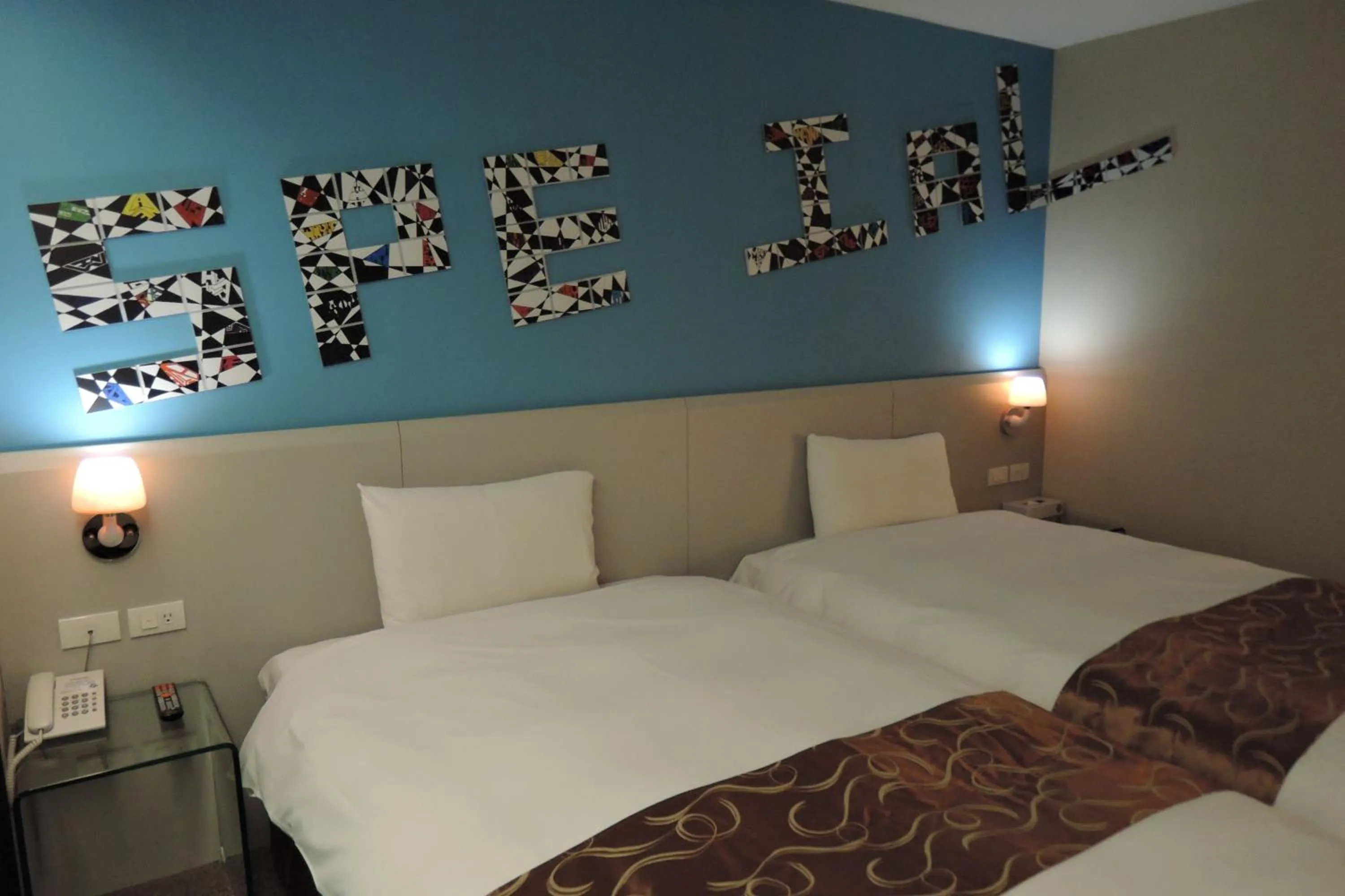 Bed in Travel Art Inn