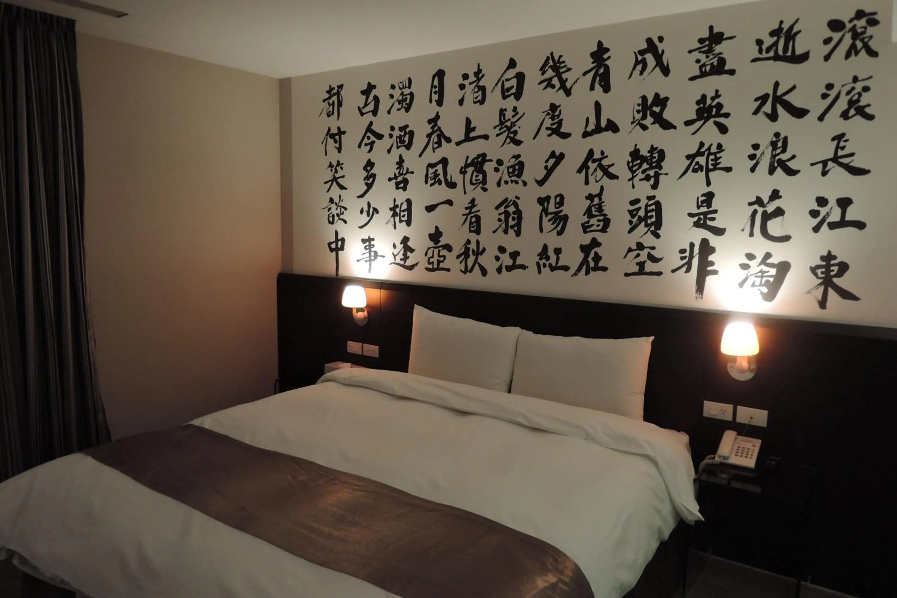 Bed in Travel Art Inn