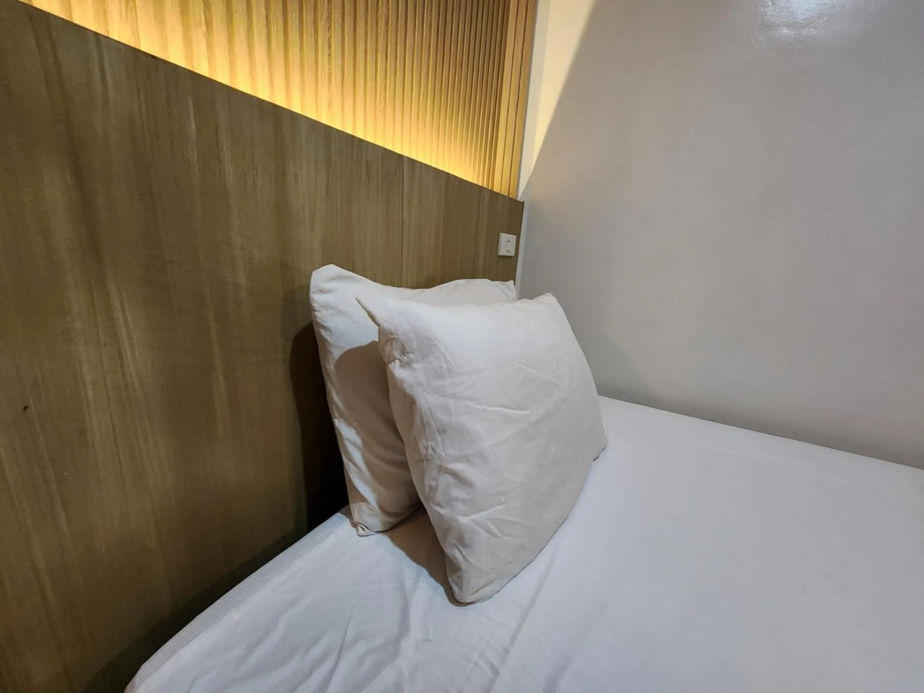 Bed in Stone House Hotel Manila