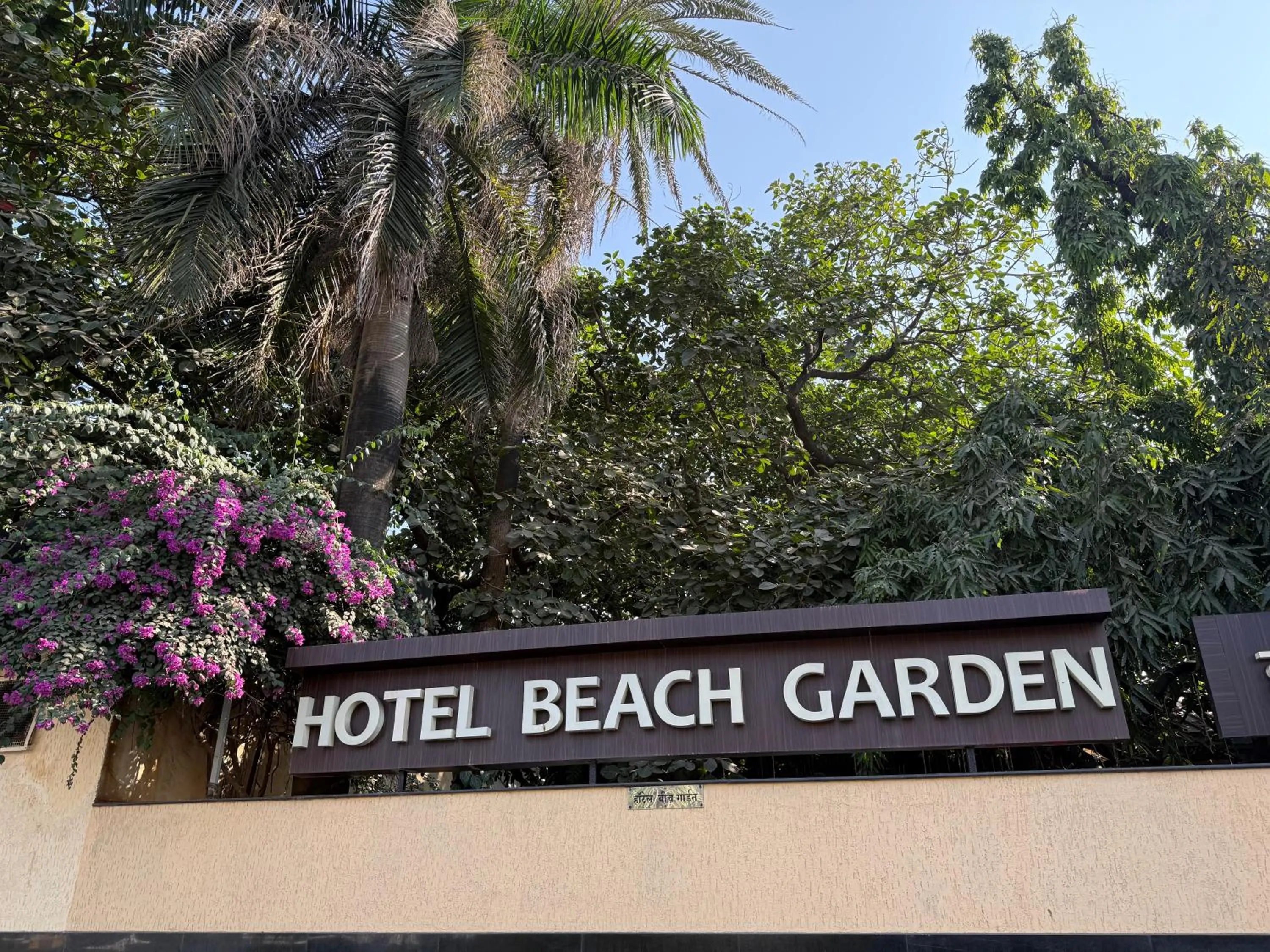 Property logo or sign in Hotel Beach Garden