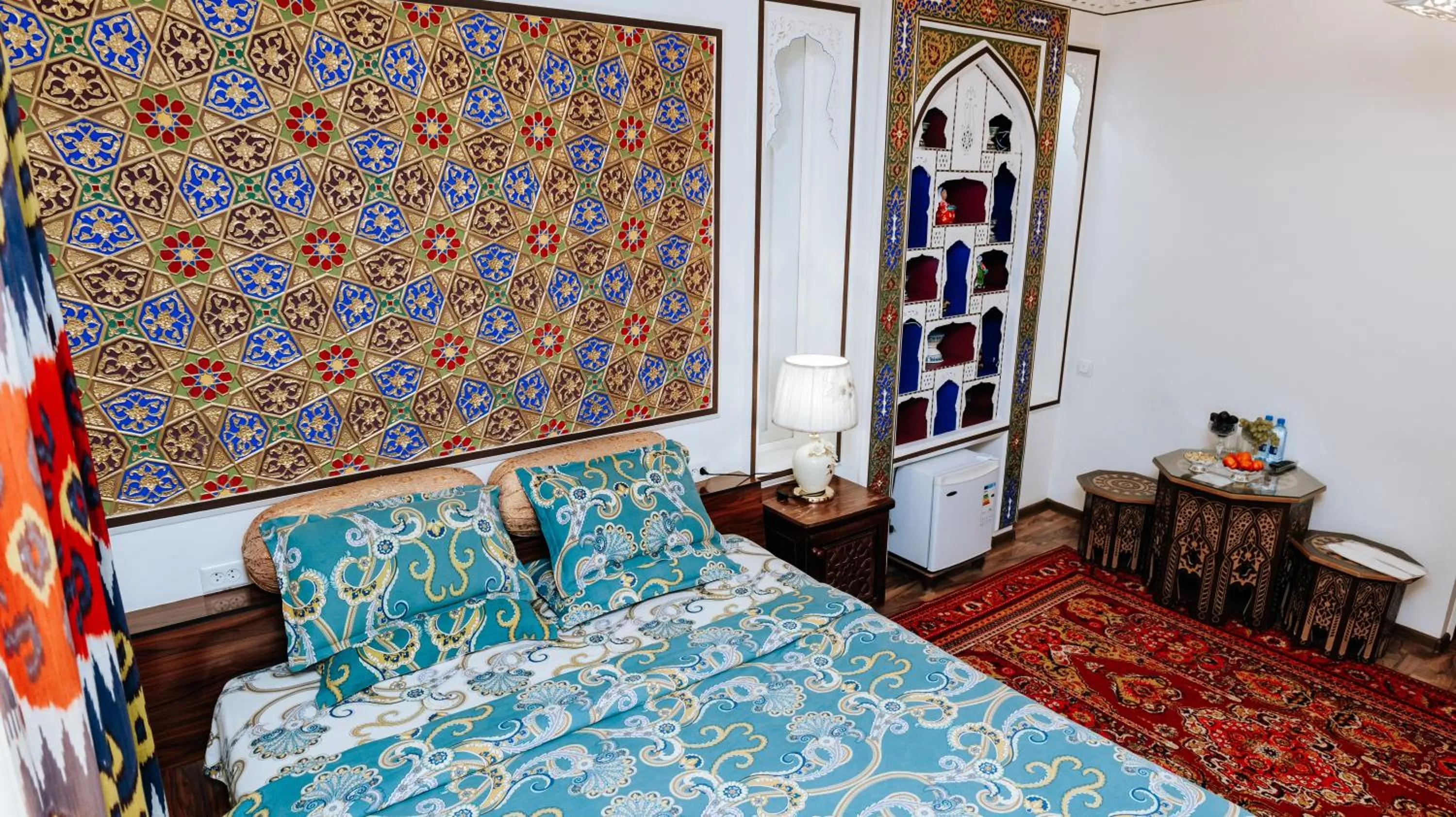 Bed in Golden Bukhara Boutique Hotel National