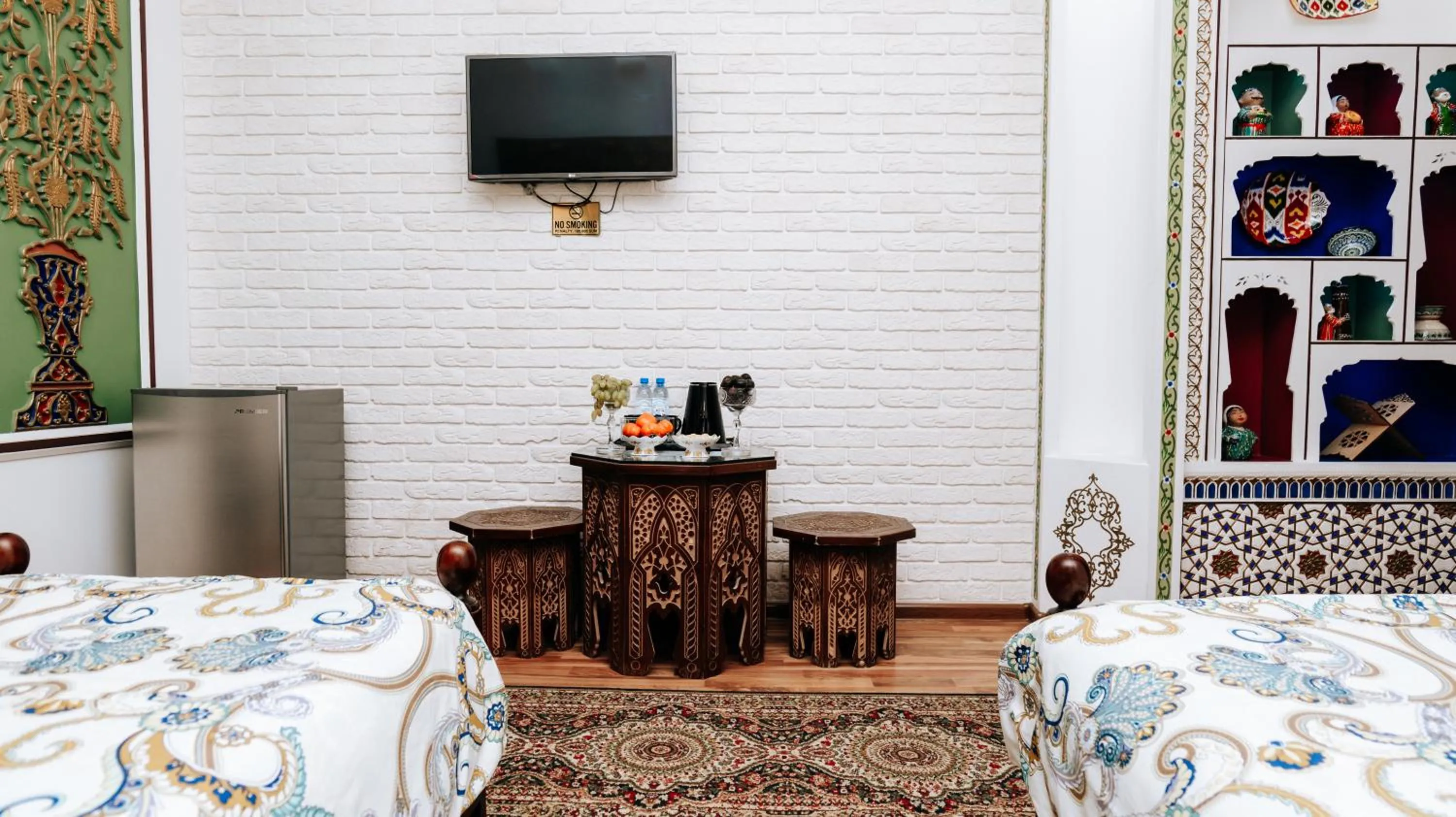 Bed in Golden Bukhara Boutique Hotel National