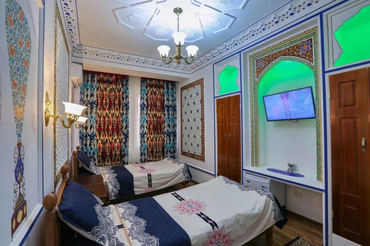 Bed in Golden Bukhara Boutique Hotel National