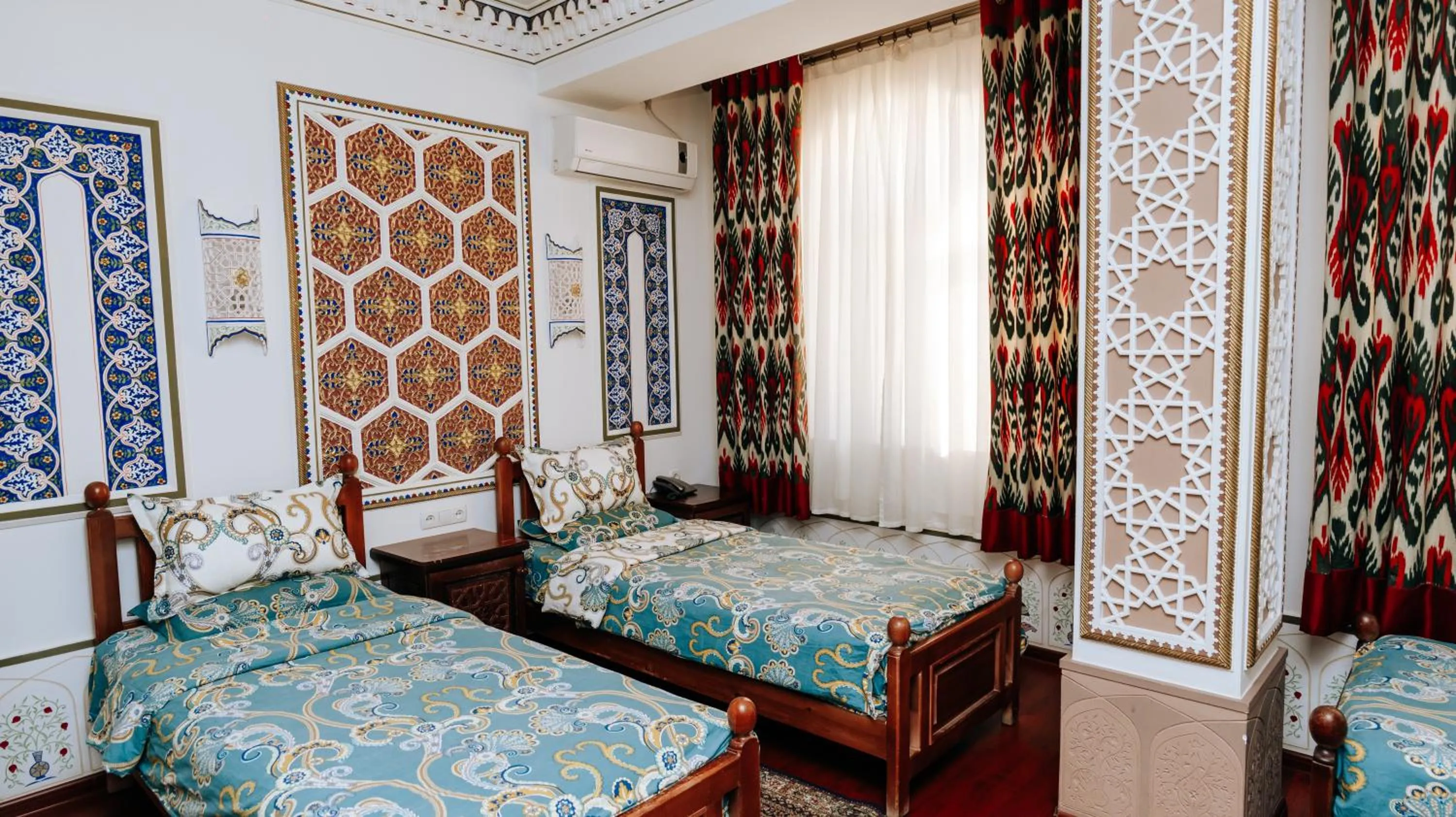 Bed in Golden Bukhara Boutique Hotel National