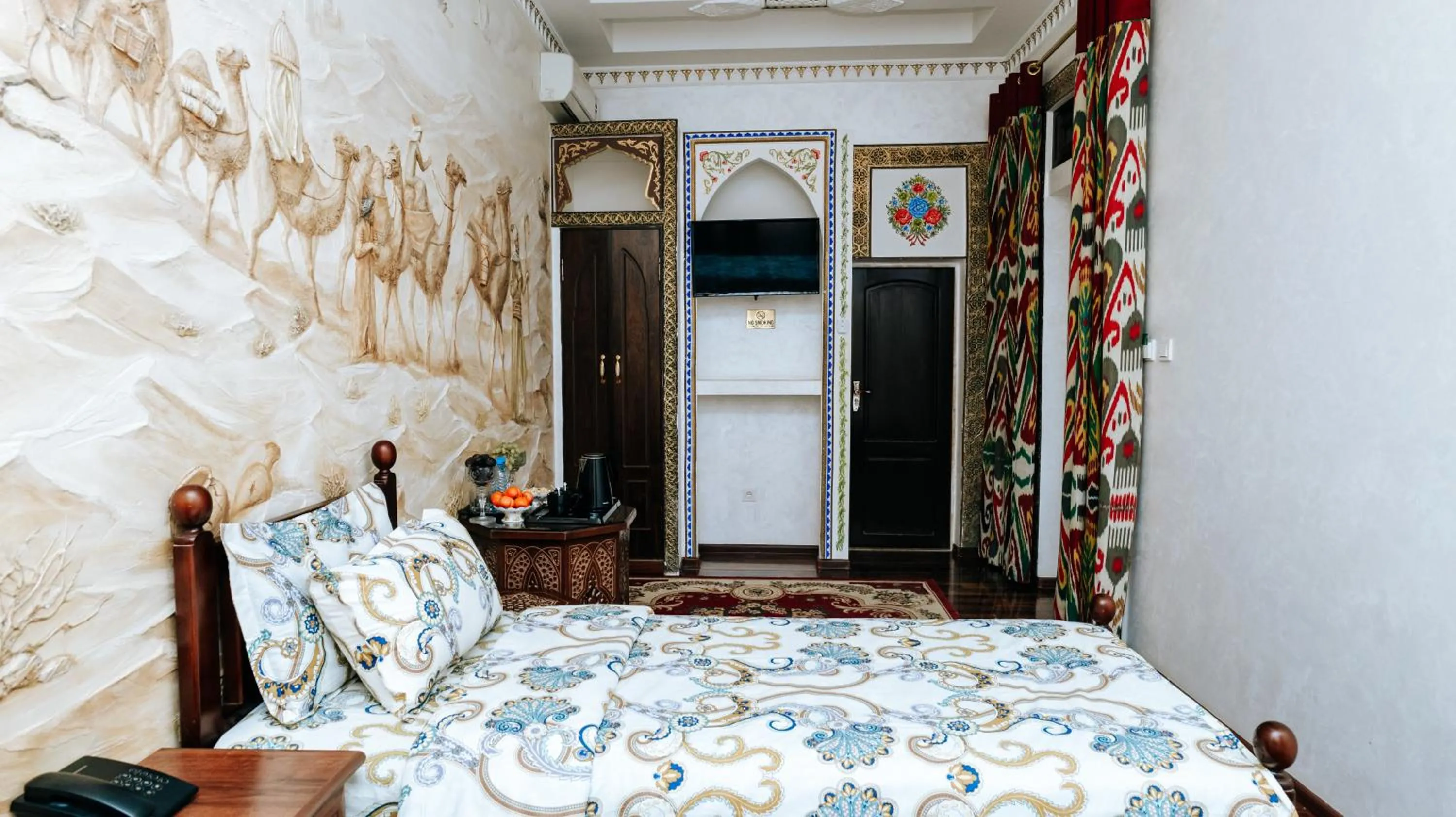 Bed in Golden Bukhara Boutique Hotel National