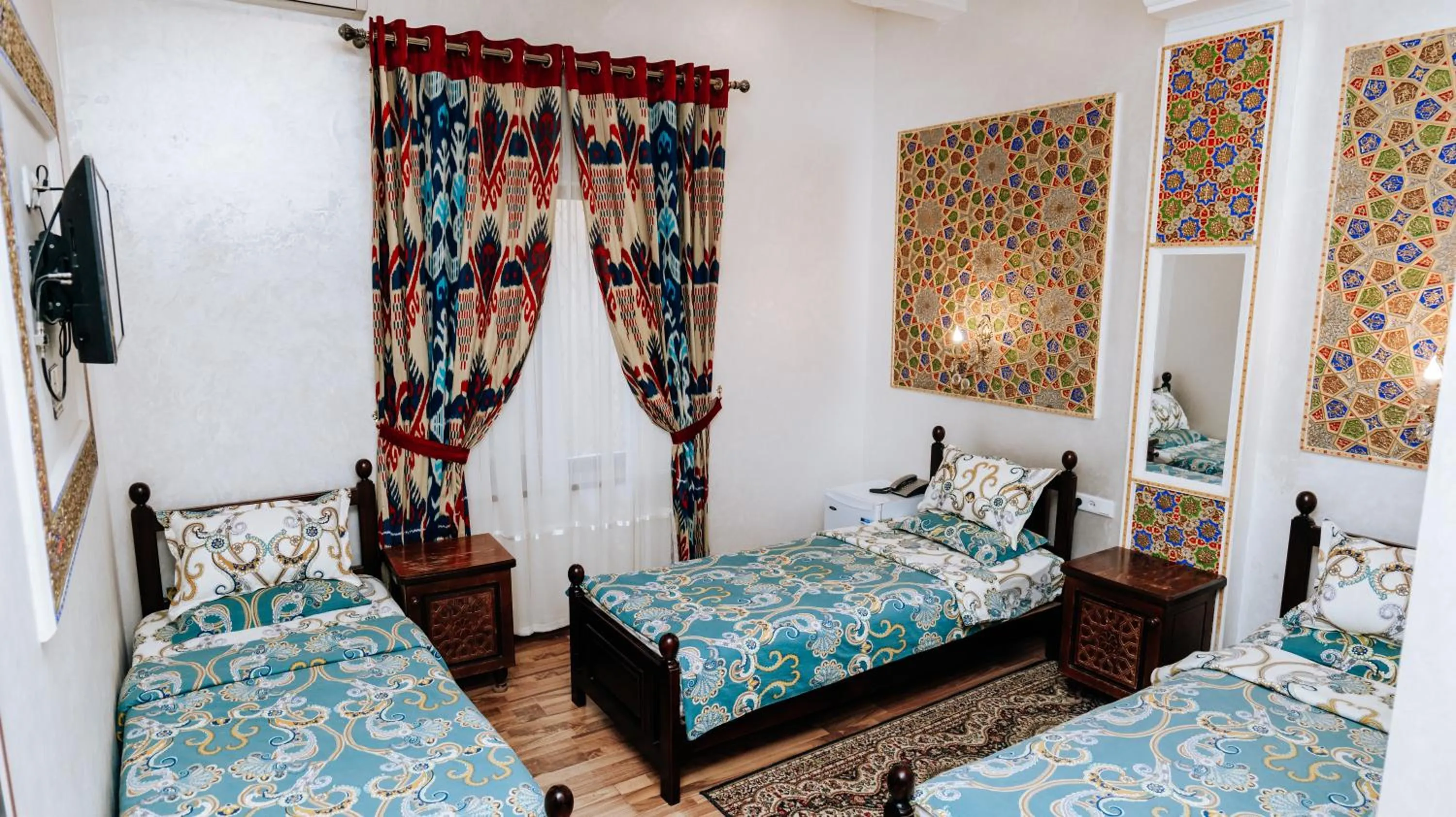 Bed in Golden Bukhara Boutique Hotel National