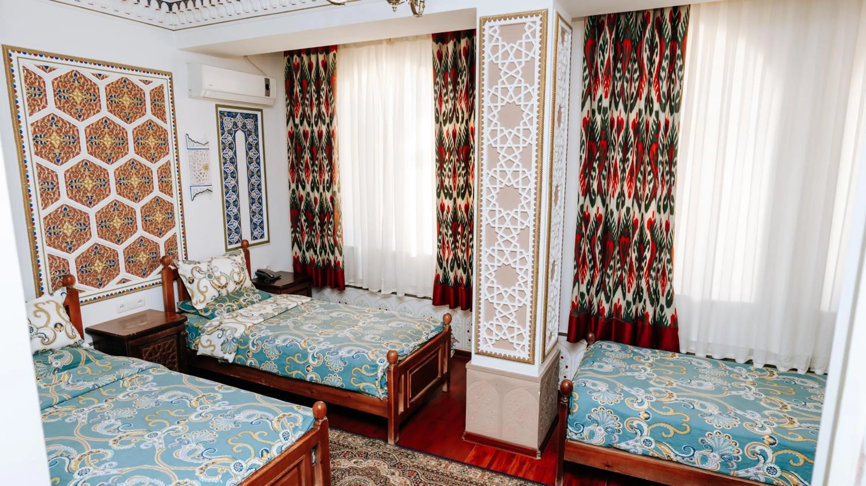 Bed in Golden Bukhara Boutique Hotel National