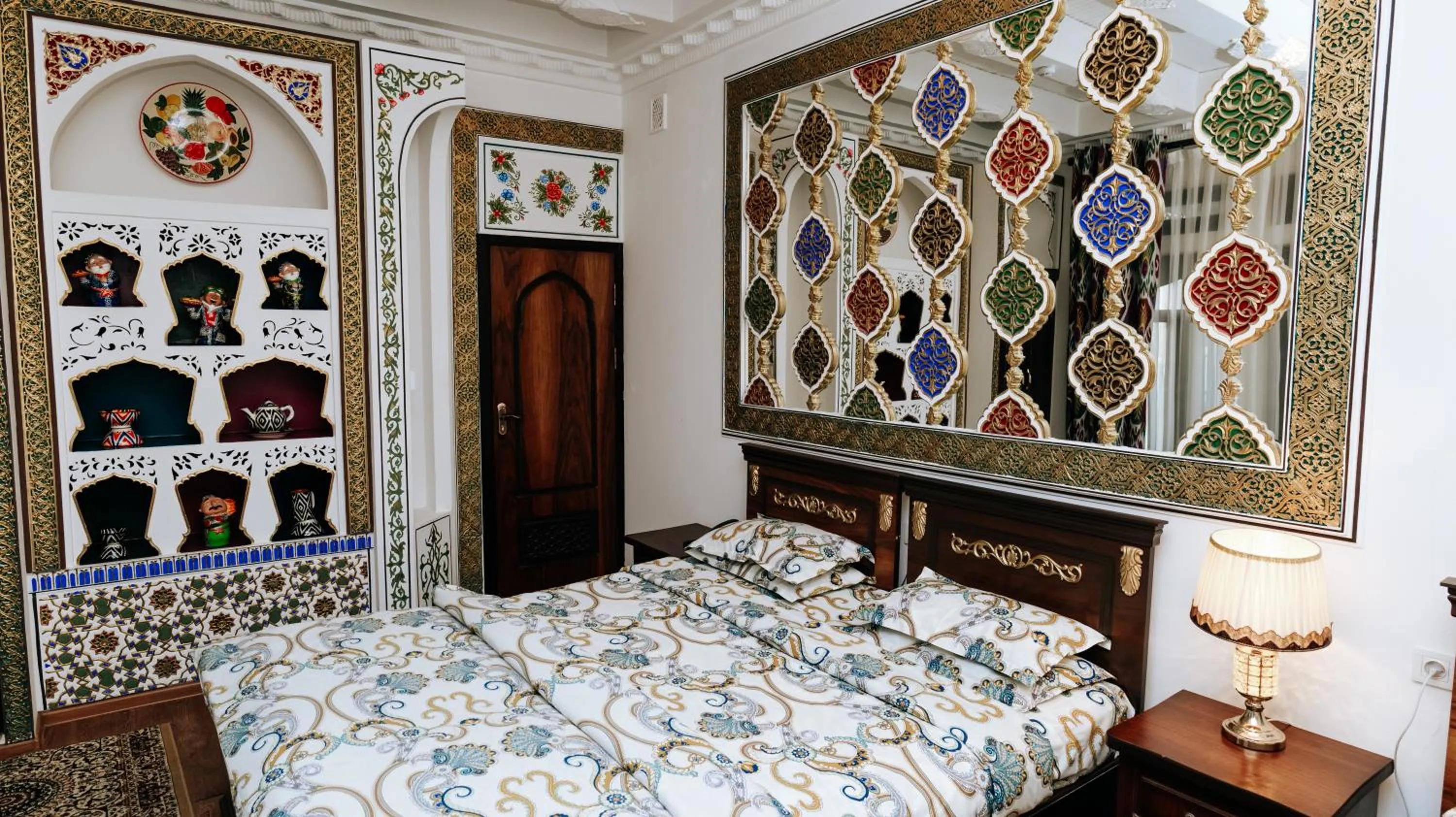 Bed in Golden Bukhara Boutique Hotel National