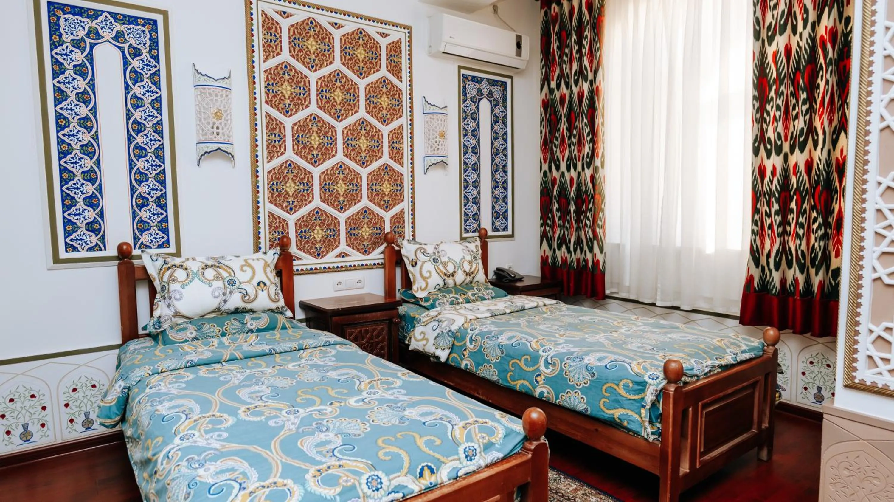 Bed in Golden Bukhara Boutique Hotel National