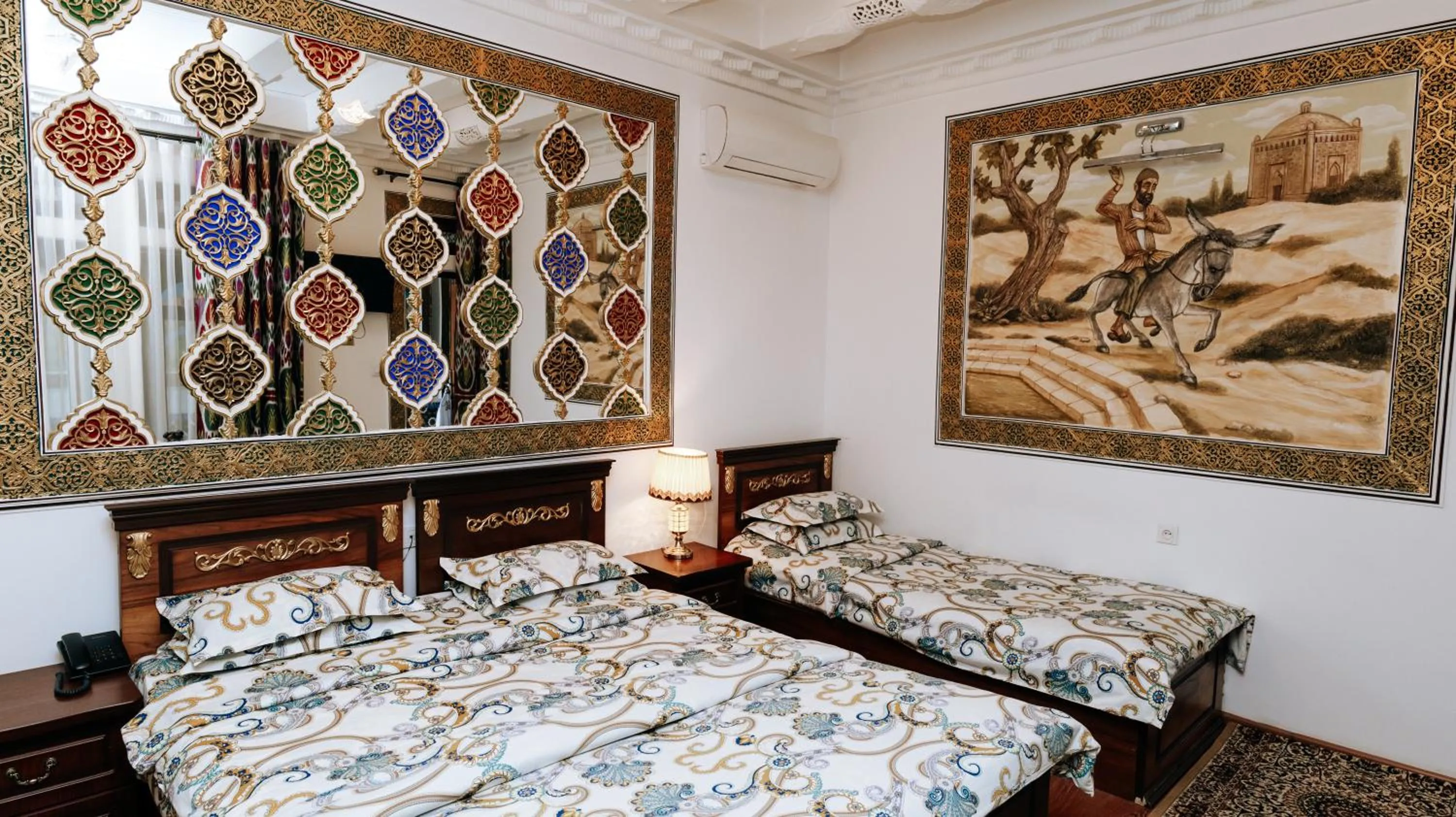 Bed in Golden Bukhara Boutique Hotel National