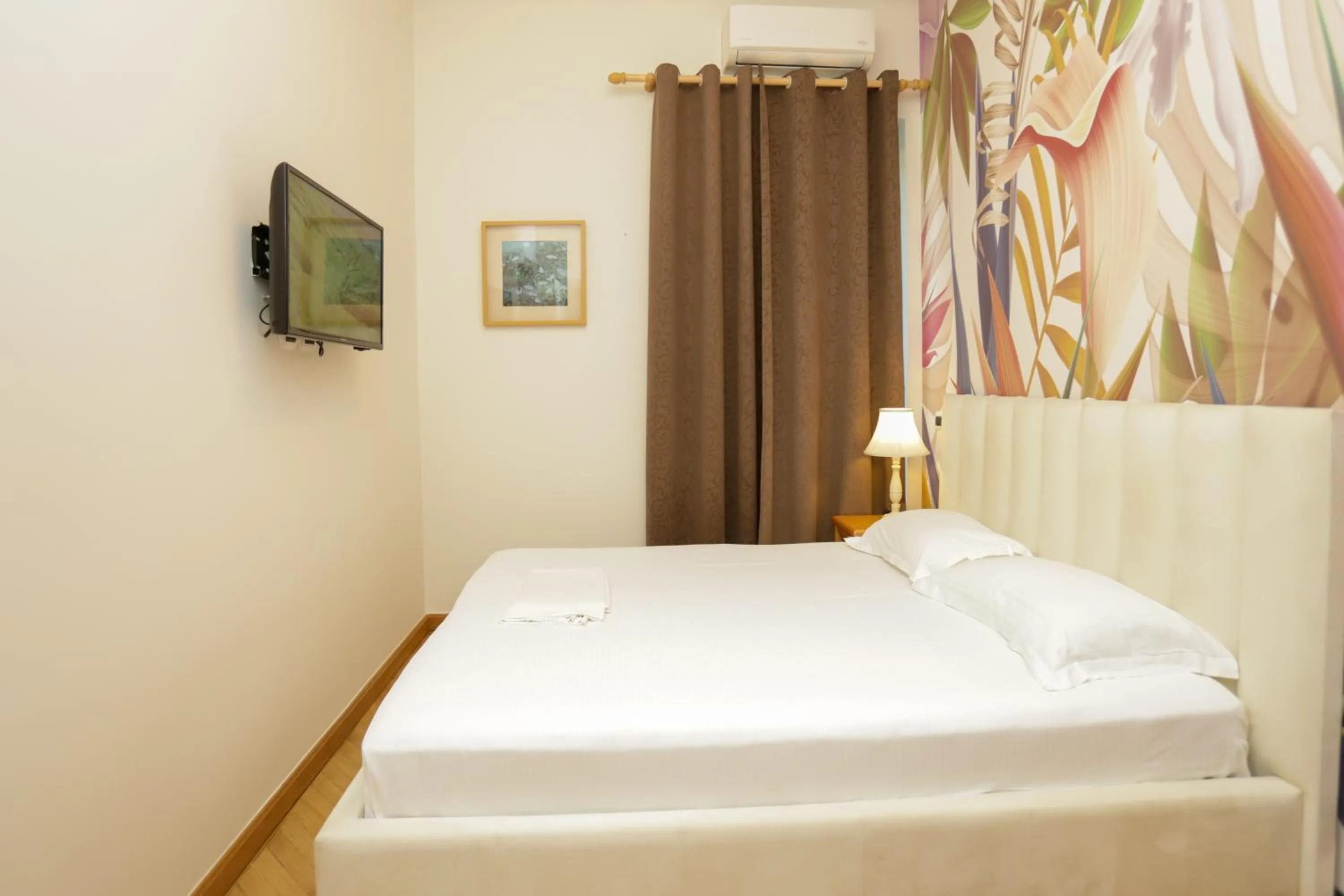 Bed in Le Palazzine Hotel