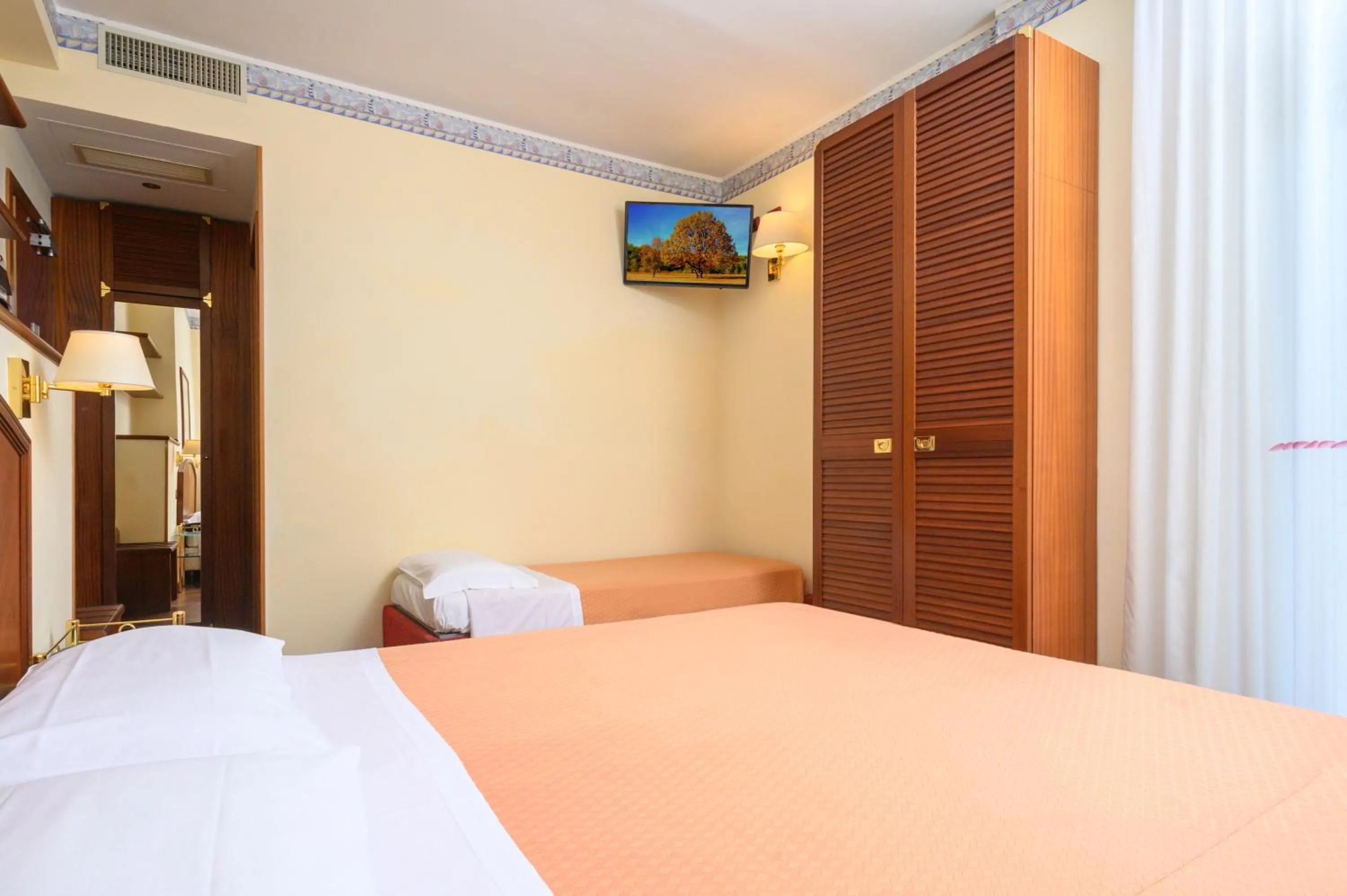Bed in Atilius Hotel & Suites
