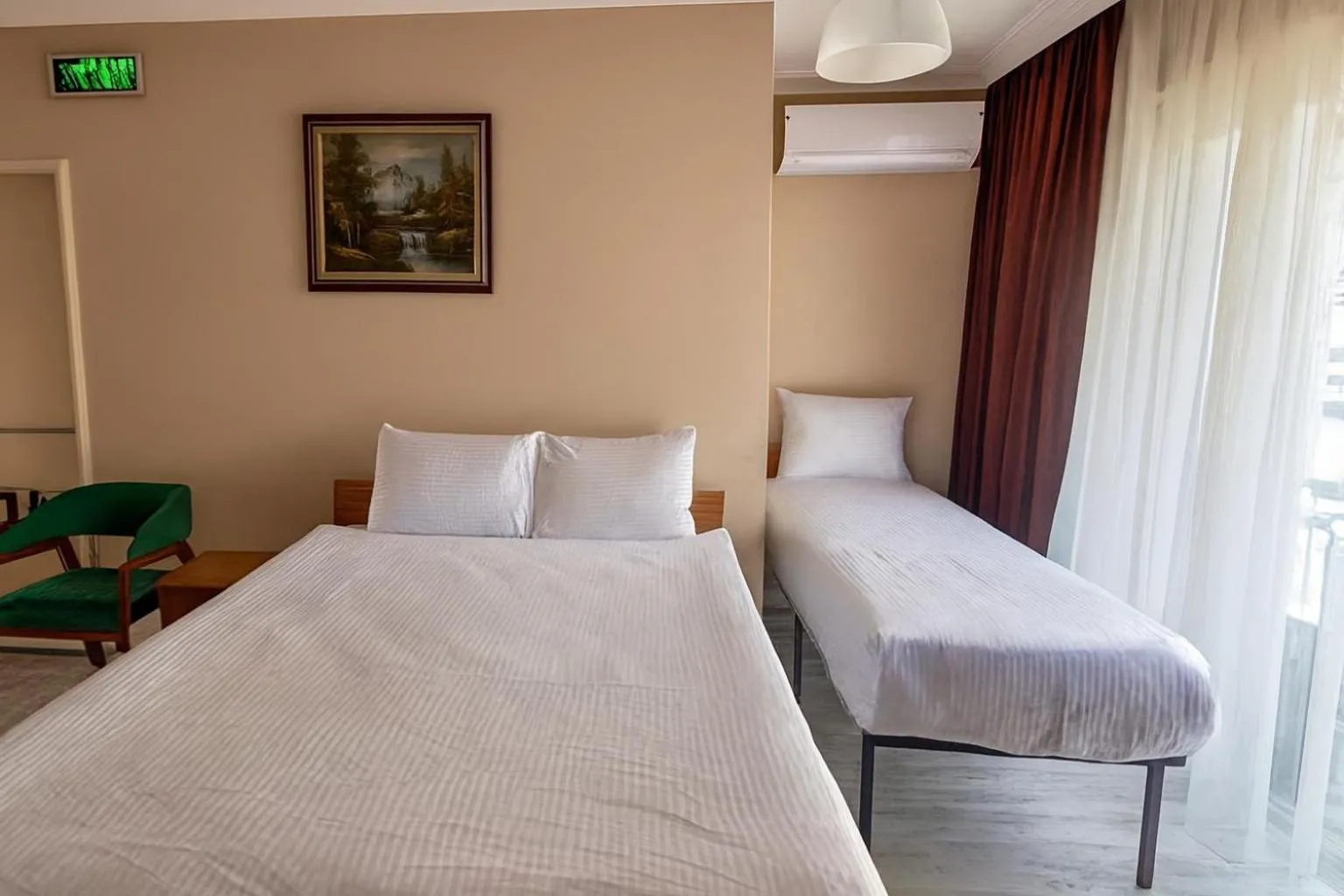 Bed in Lion Stone Hotel